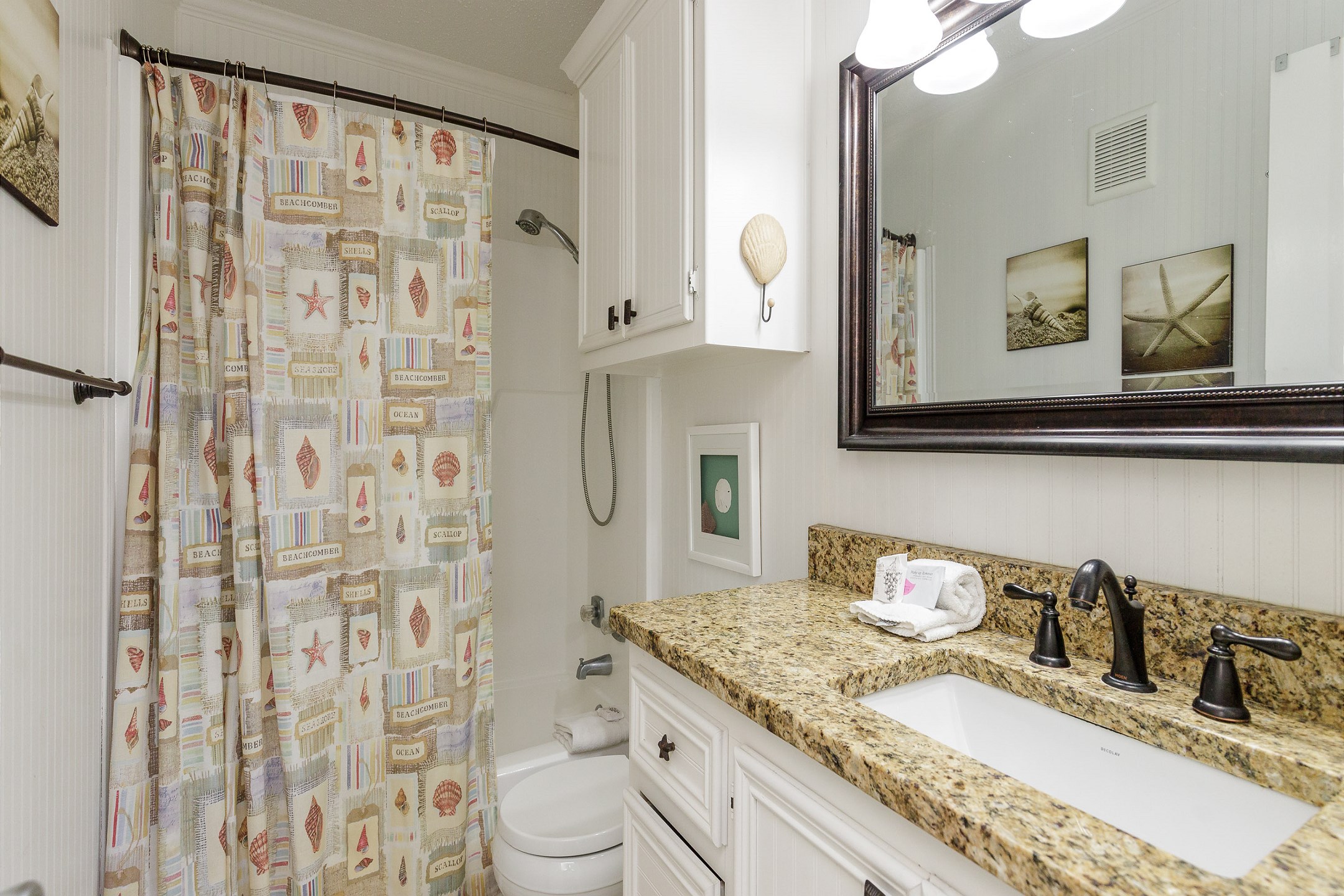 Guest bathroom with tub and shower