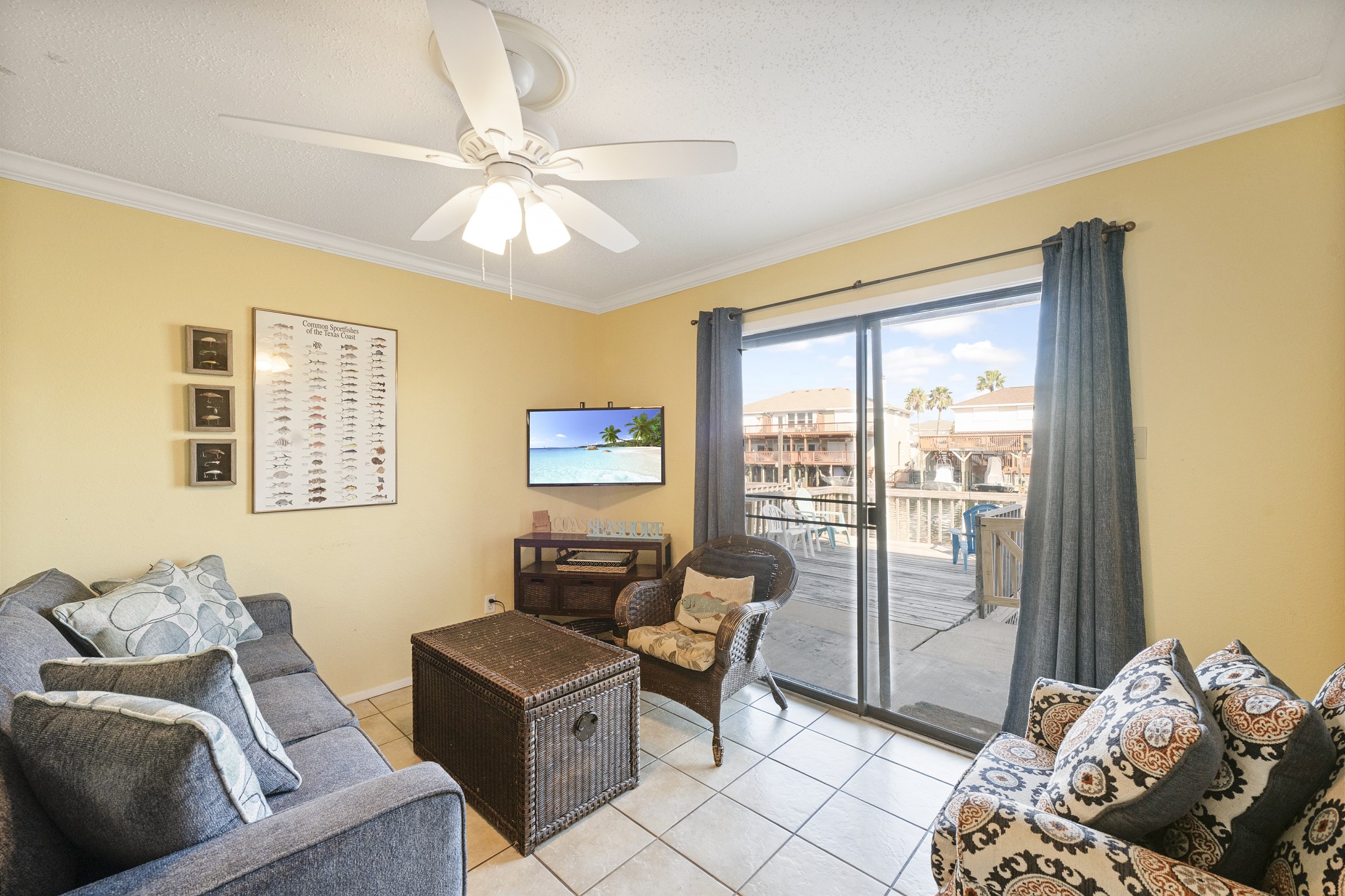 Living area with flat screen TV and views of the canal