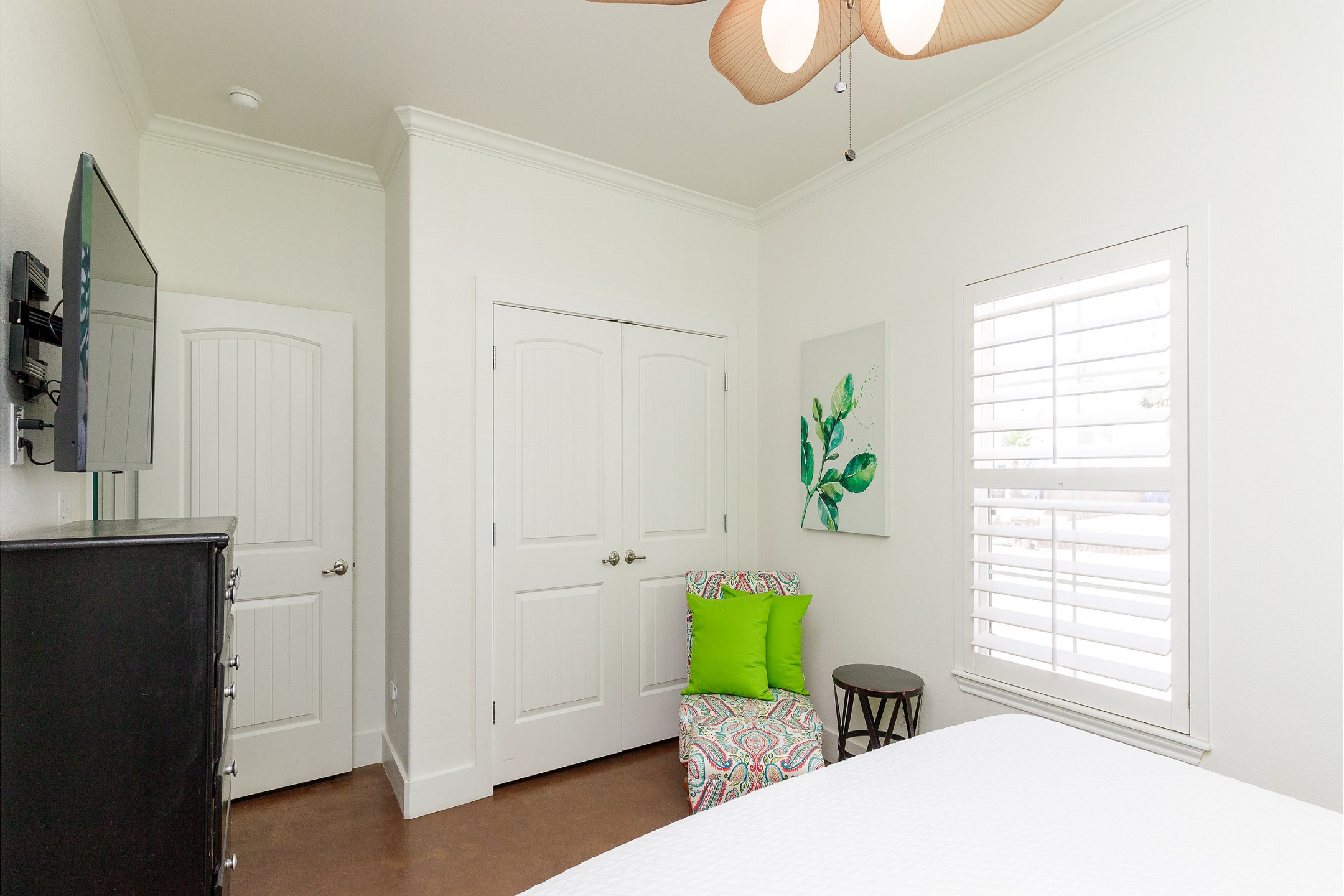 Updated master bedroom with king size bed private bathroom, flat screen TV, and new décor 