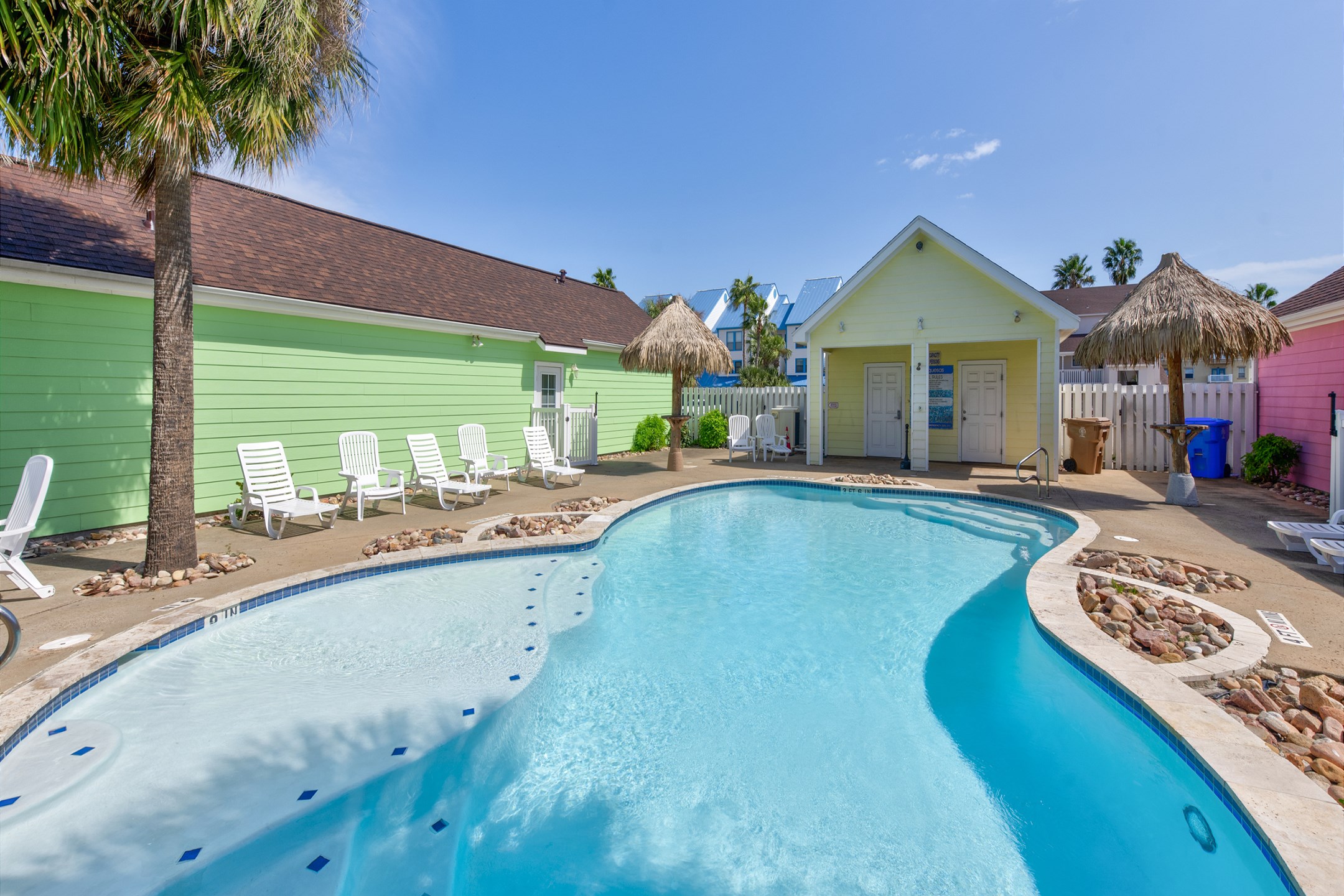 Refreshing oasis-style pool with sparkling water and comfy loungers to enjoy
