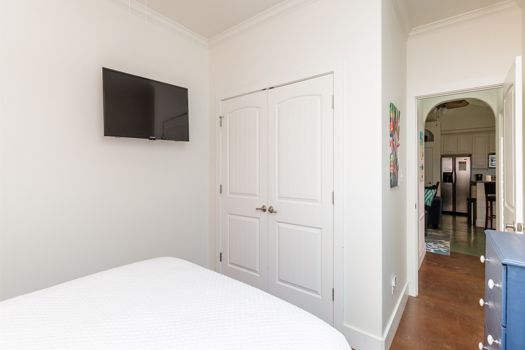 Updated second bedroom with queen size bed, flat screen TV, fresh paint, and new décor 