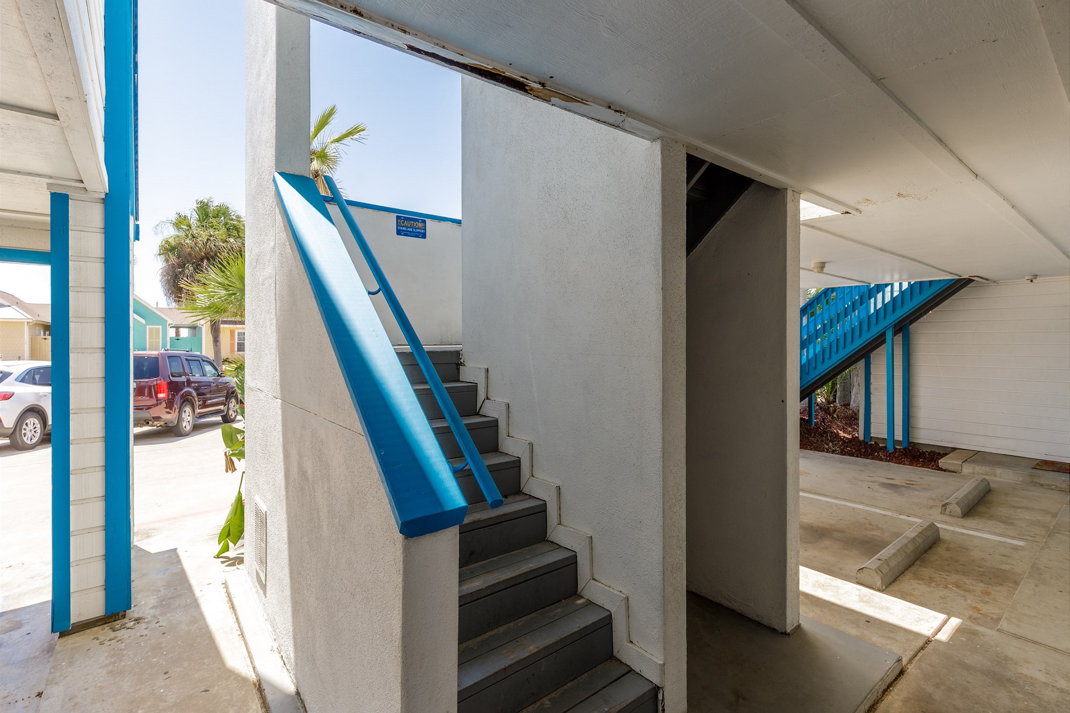 Stairs leading to the second floor to the main entrance 