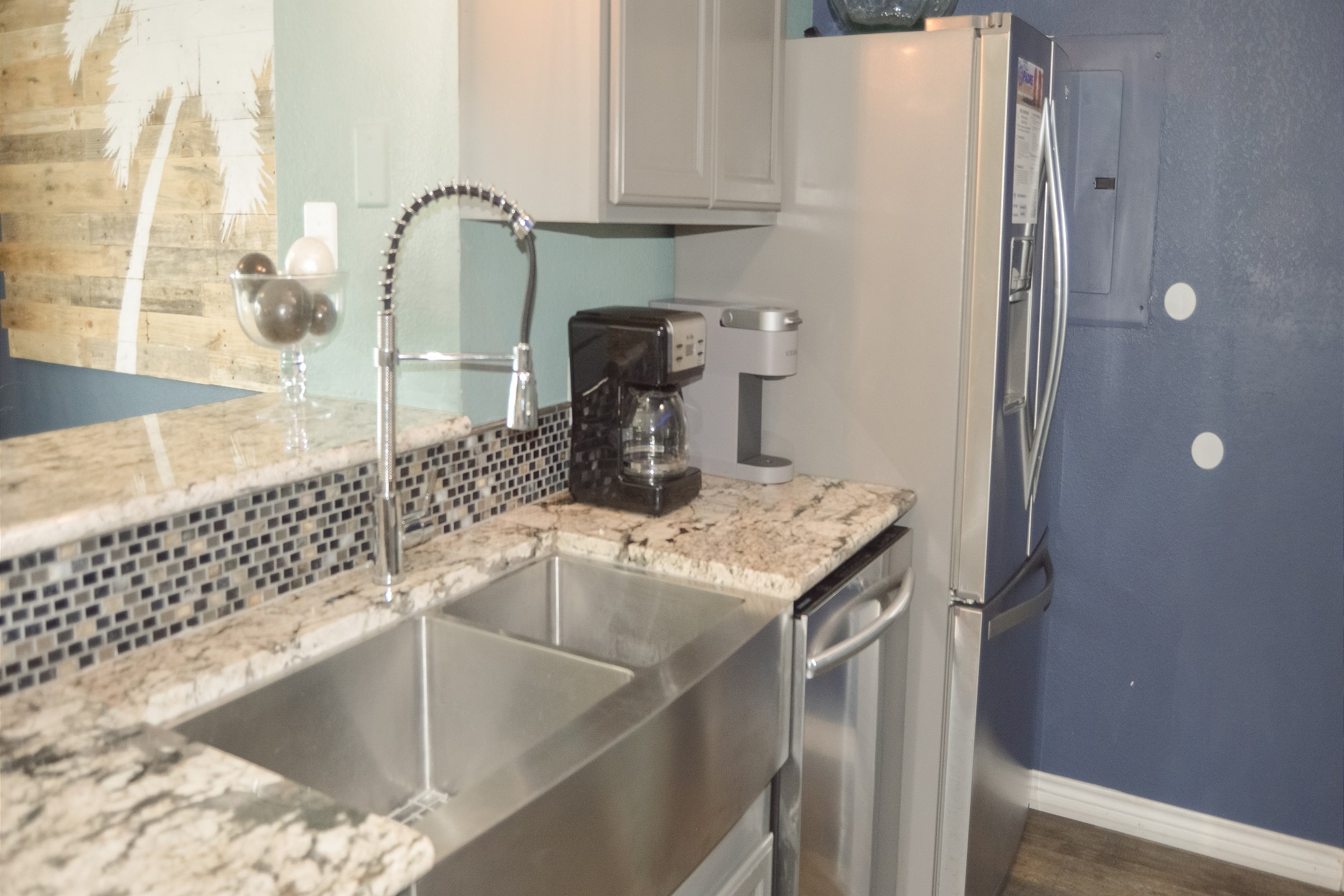 Great kitchen space to cook meals with the family that includes a Keurig and 12-cup coffee maker 