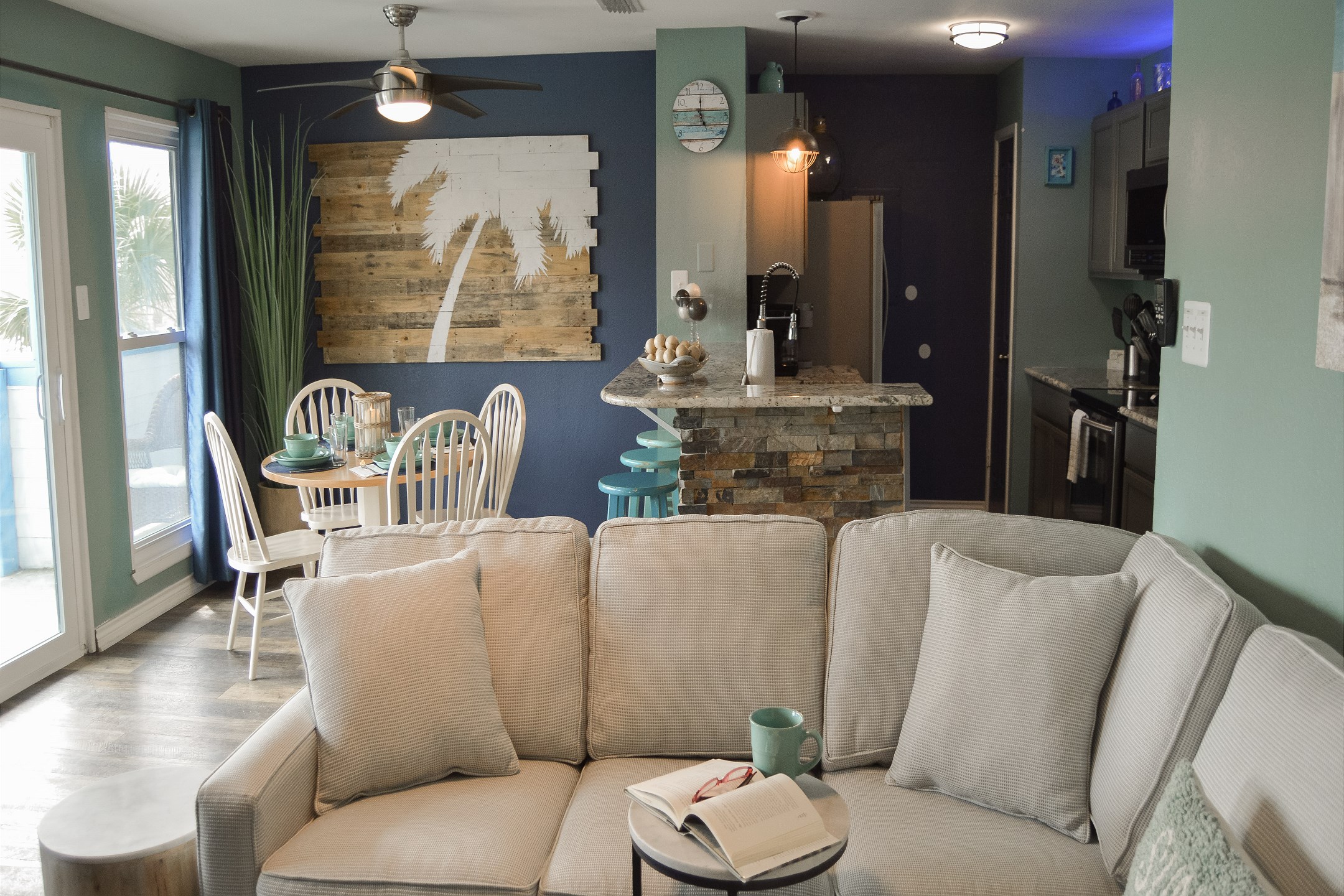 Spacious living, dining and kitchen area with beautiful views and private balcony 