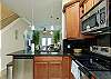 Beautiful counter tops and cabinets in kitchen area