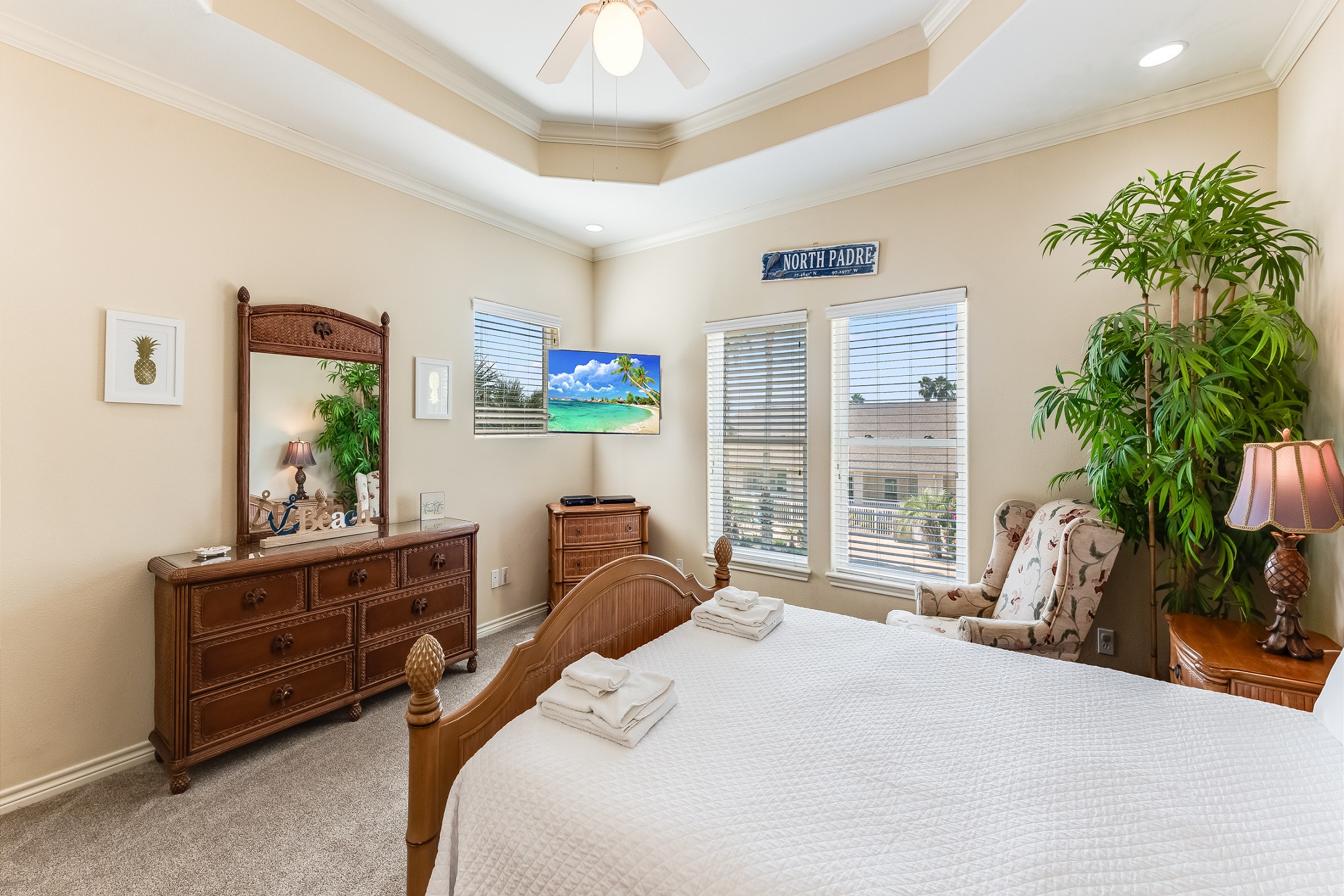 Master bedroom on the second floor with queen size bed, memory foam mattress, flat screen TV, and ensuite bathroom 