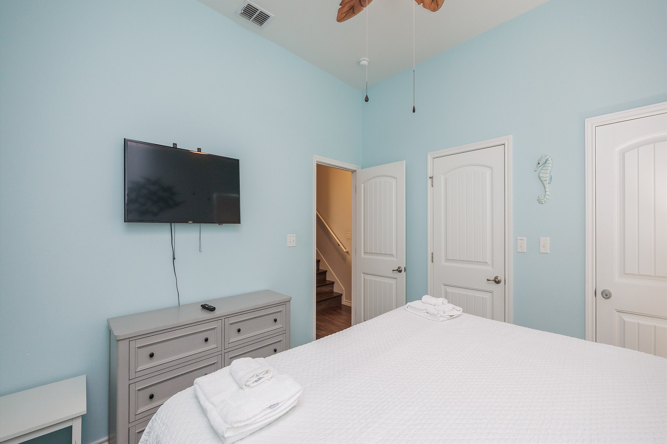 Master bedroom on the first floor with king size bed and flat screen TV