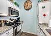 Fully equipped kitchen with stainless steel appliances and 12-cup coffee maker 