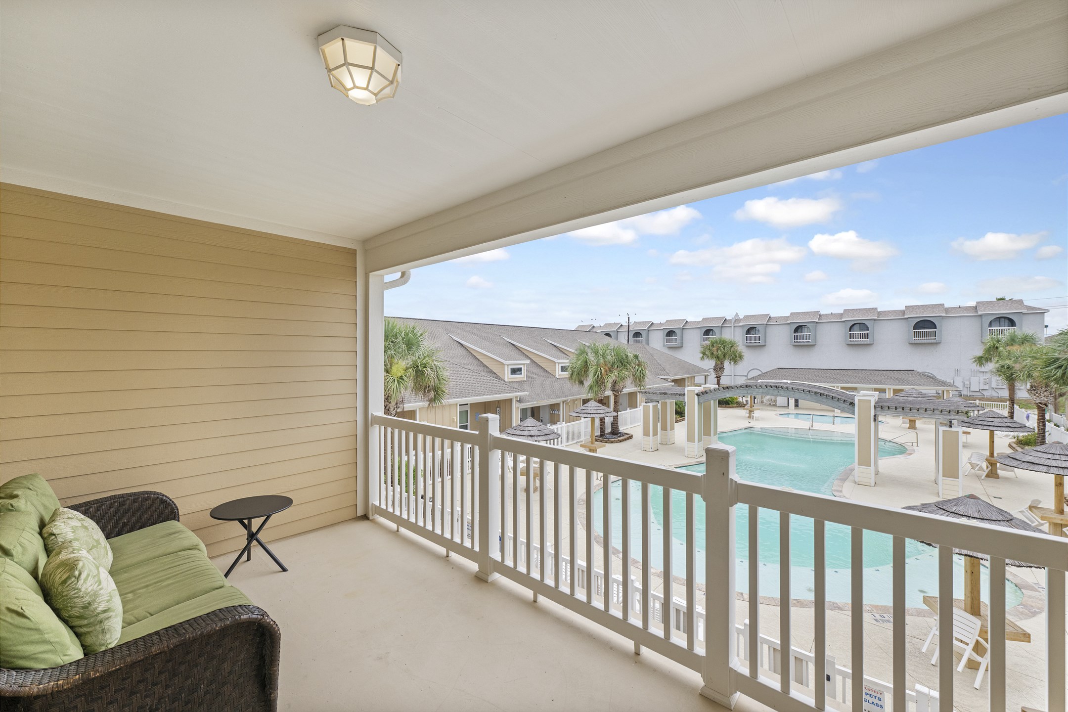 Private balcony off the second bedroom, to sit and relax while watching the family splash around in the sparkling pool below