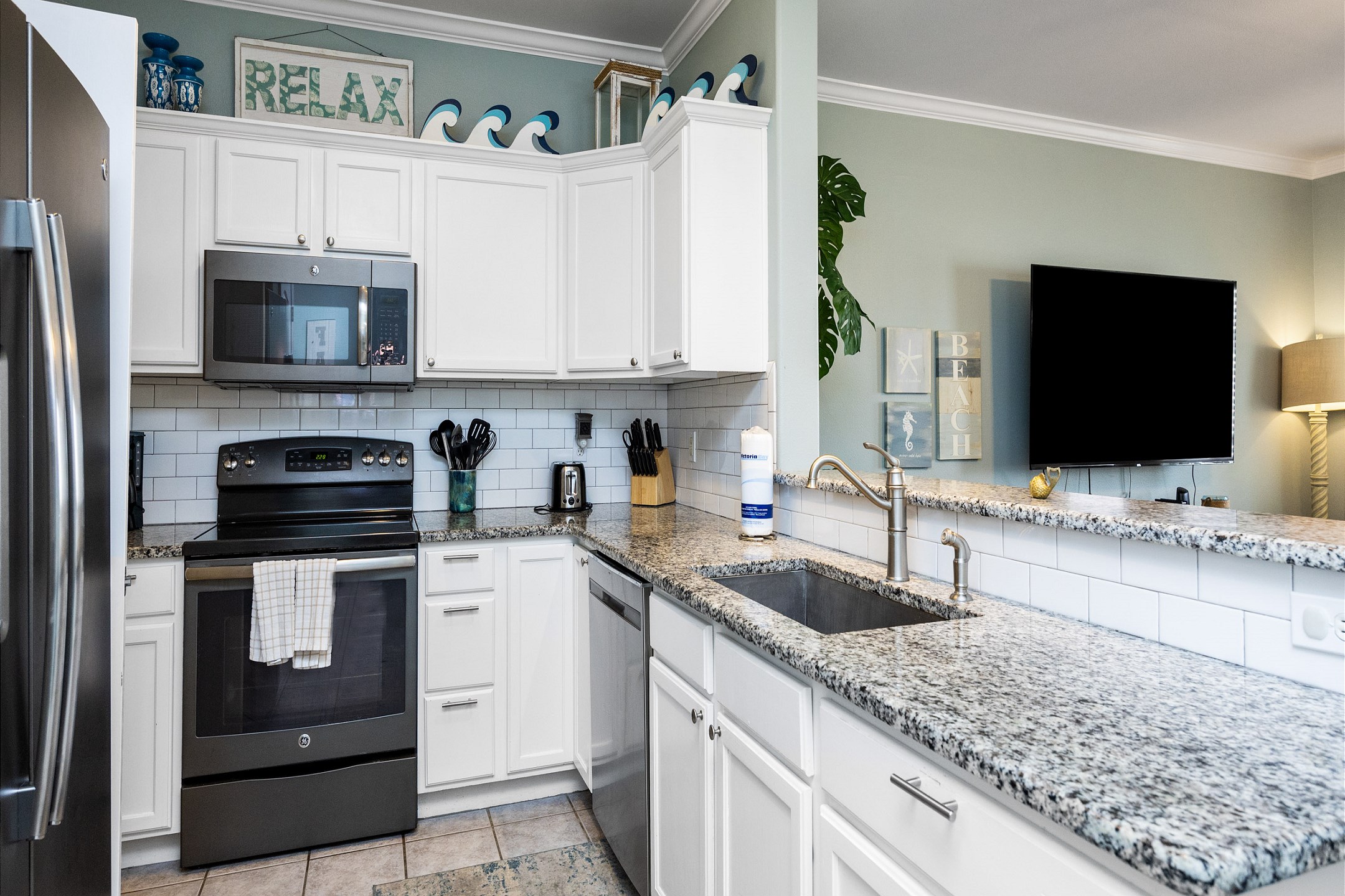 Fully equipped kitchen with stainless steel appliances and plenty of counter space to cook throughout the day