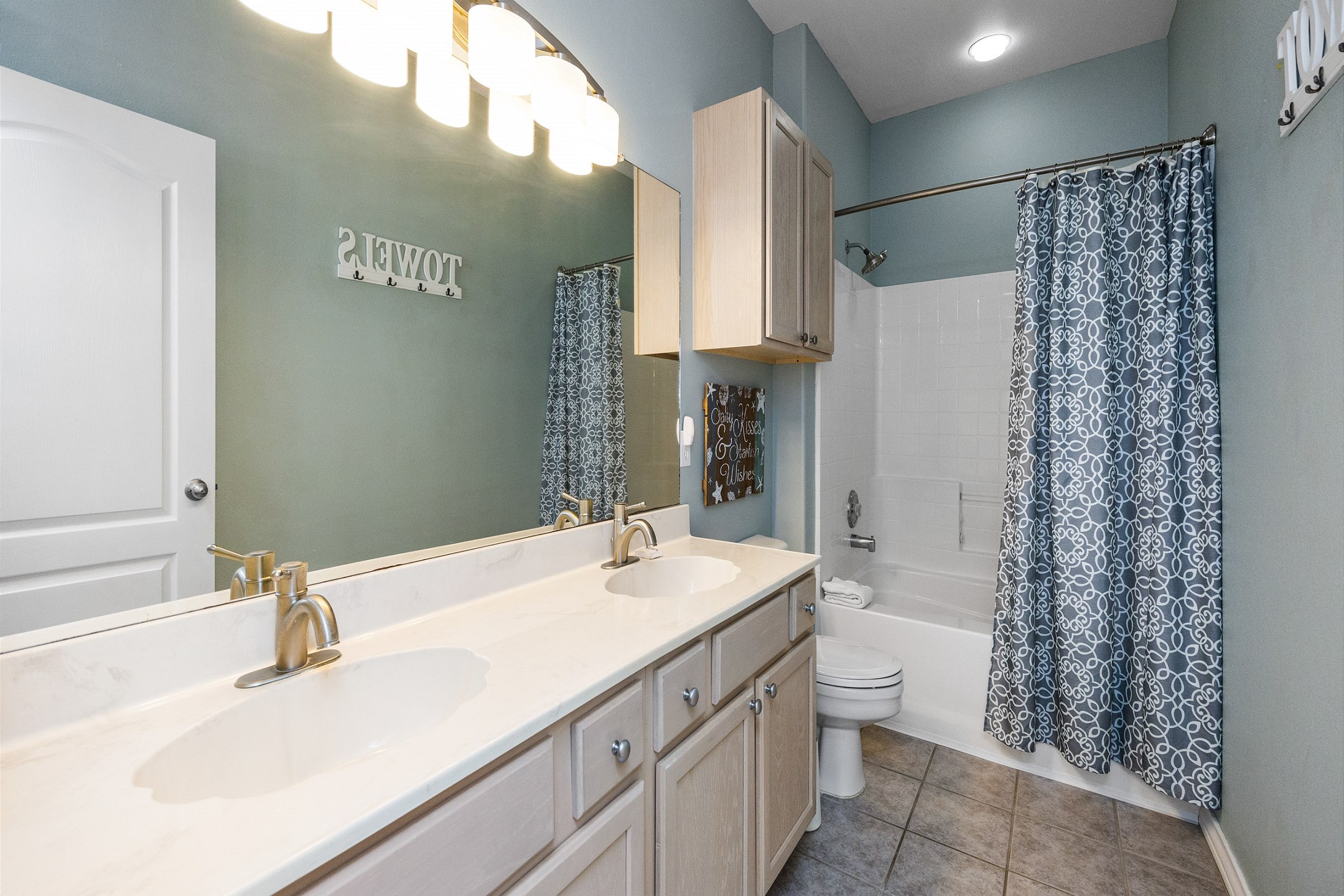 Master bathroom on the second floor with double sinks, along with tub and shower