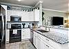 Fully equipped kitchen with stainless steel appliances 