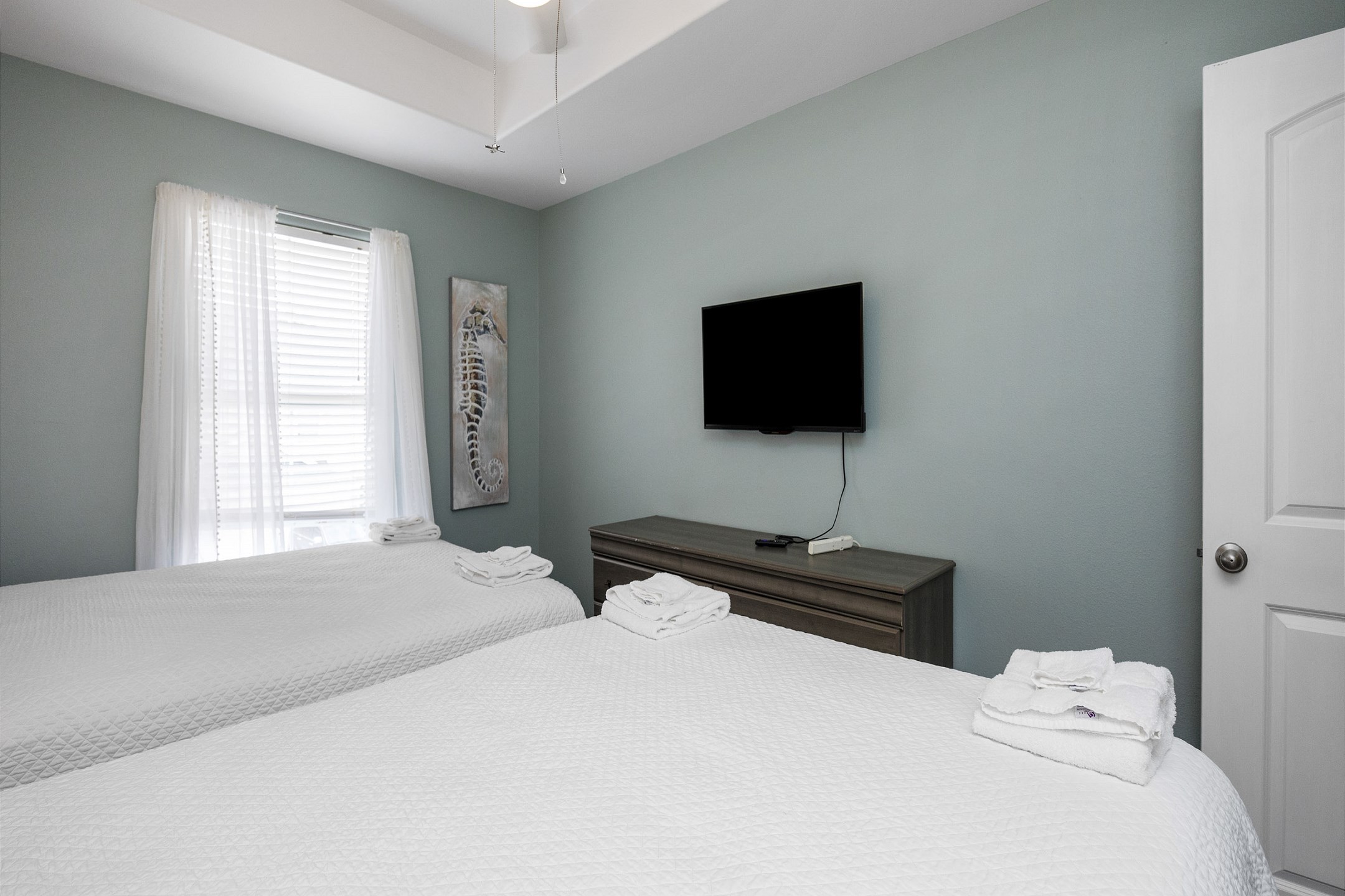 Third bedroom on the second floor with two queen size beds and flat screen TV 