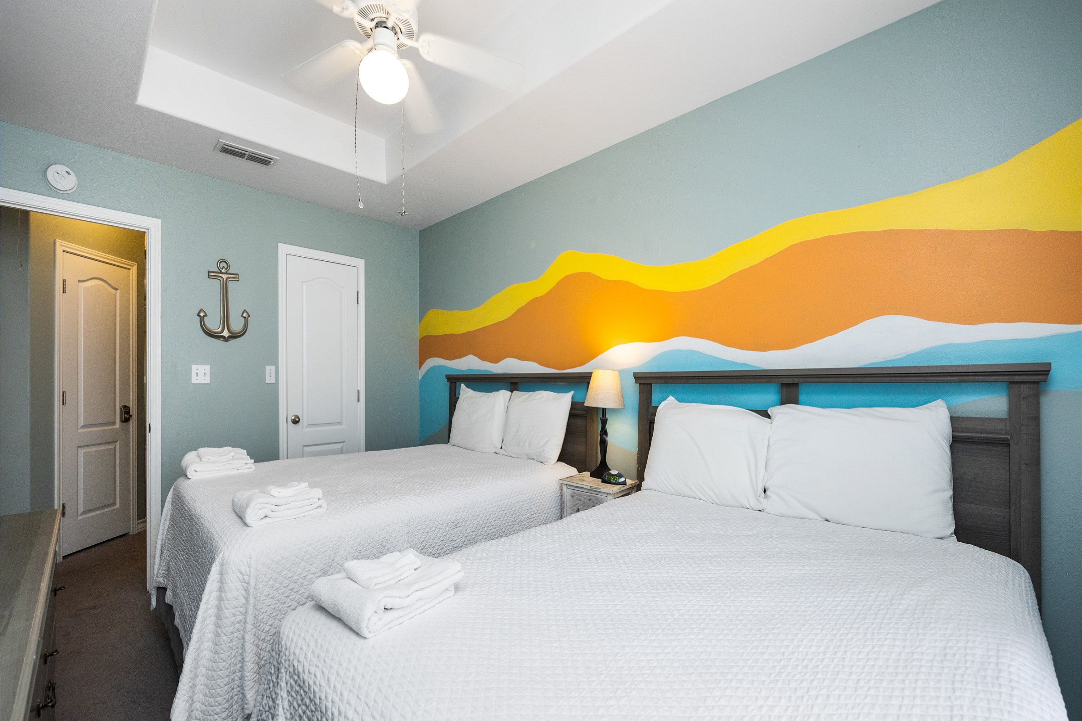 Third bedroom on the second floor with two queen size beds and flat screen TV 