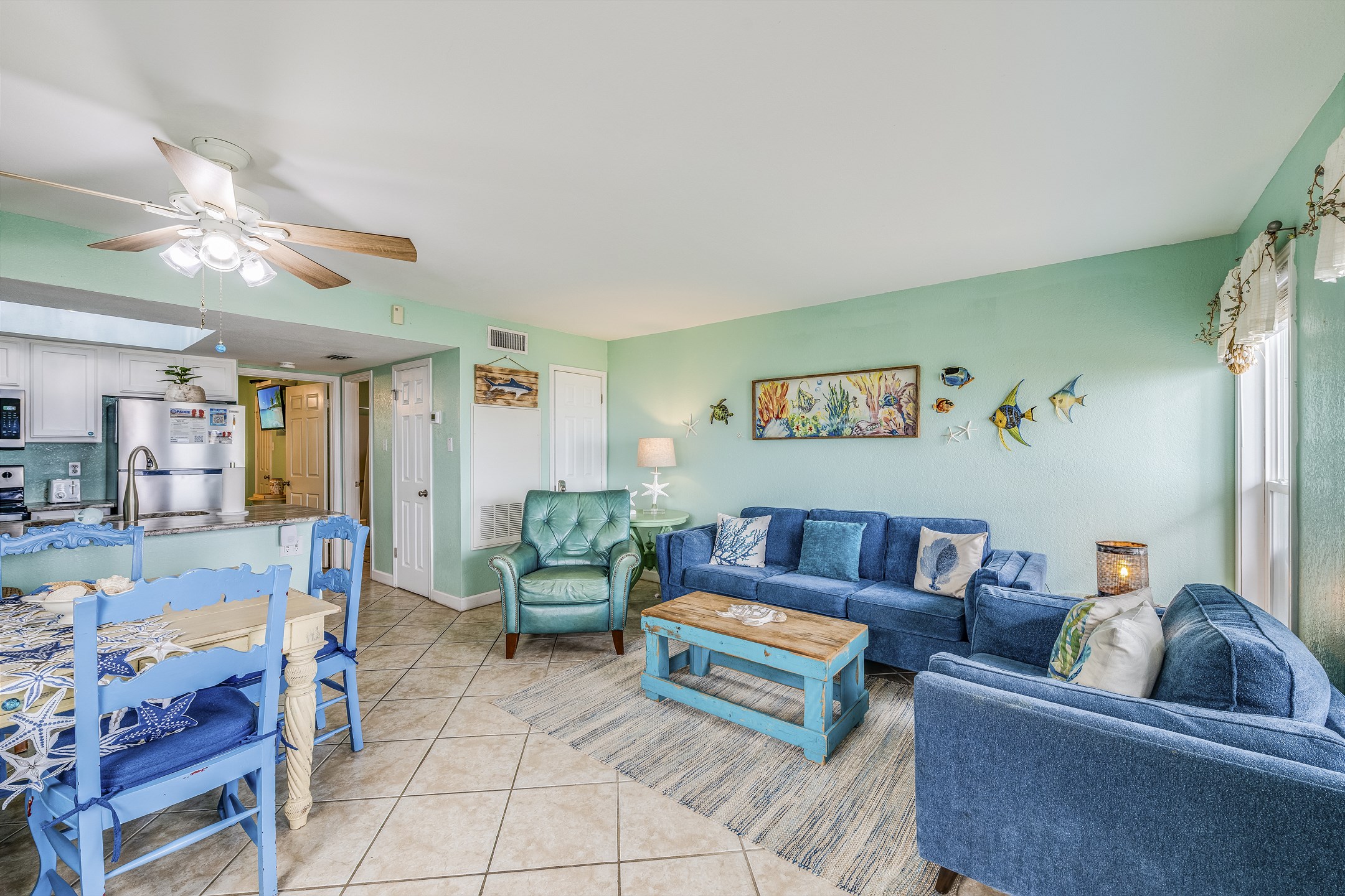 Stylish living room with chic décor and seamless flow into kitchen and dining