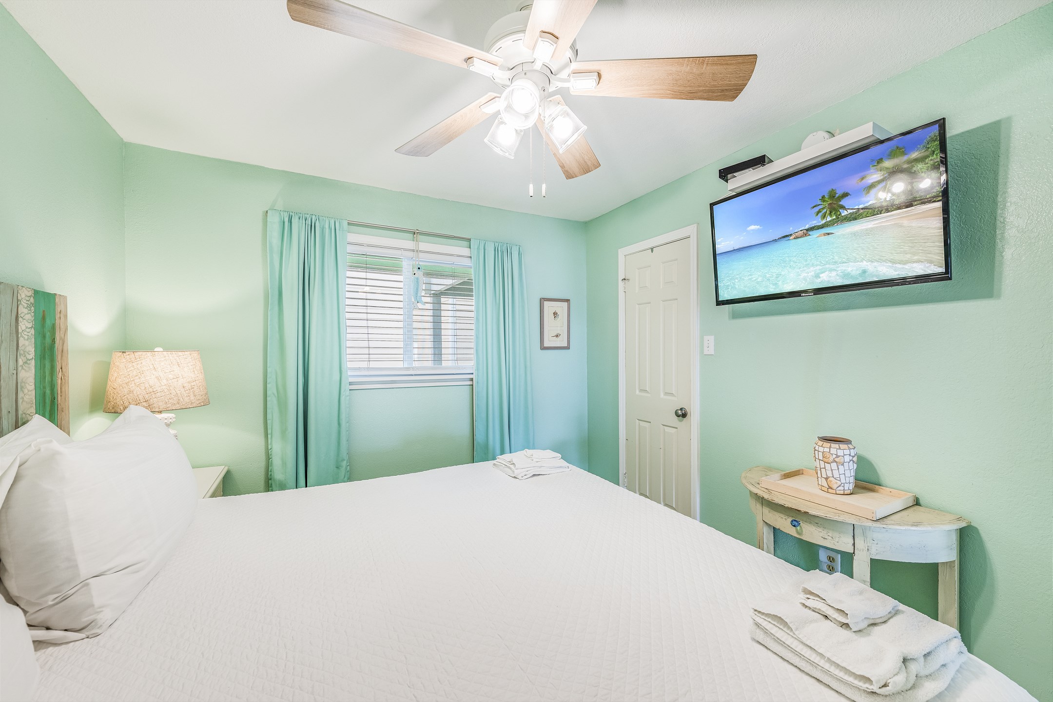 Master bedroom with king size bed with flat screen TV
