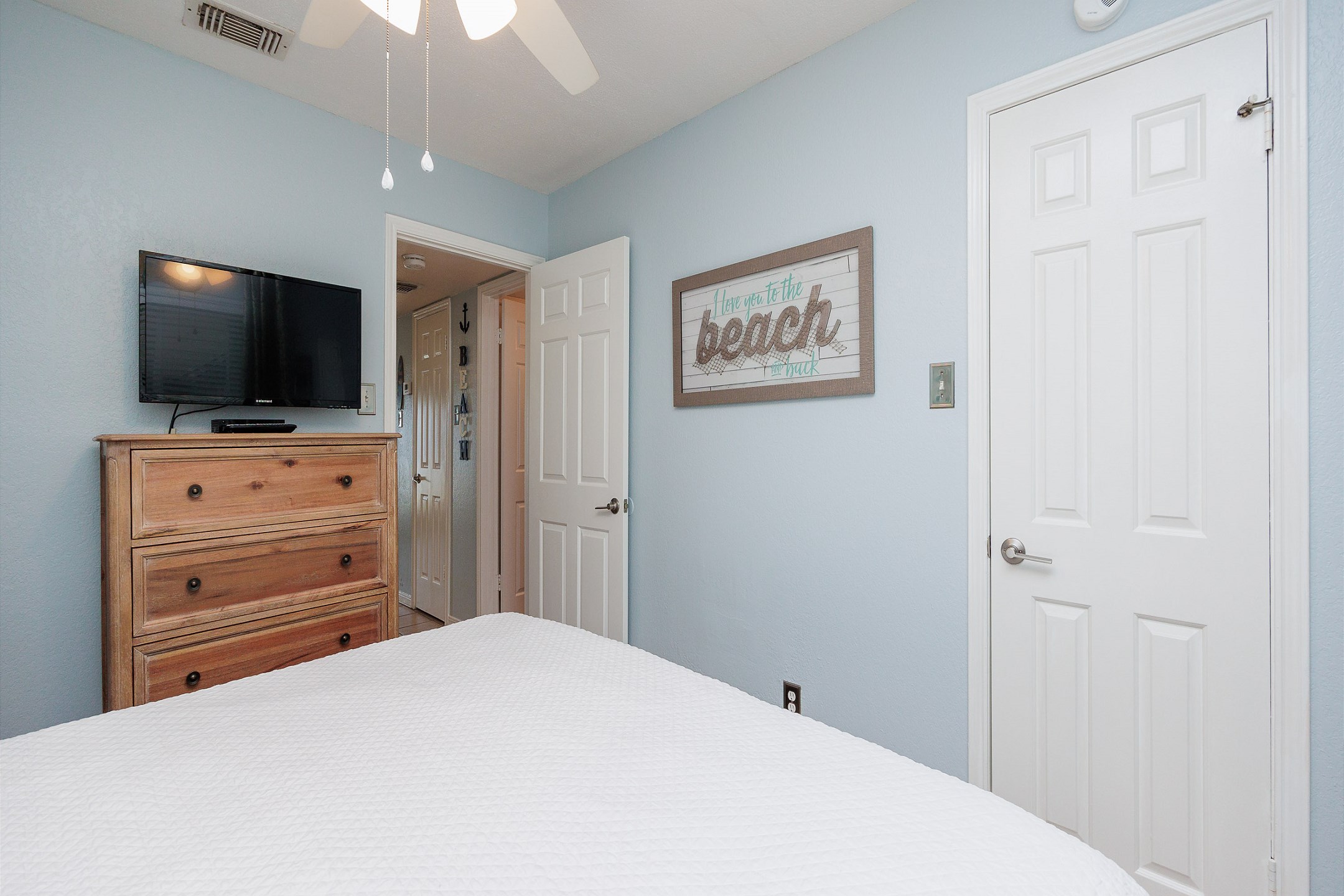 Master bedroom with king size bed and flat screen TV