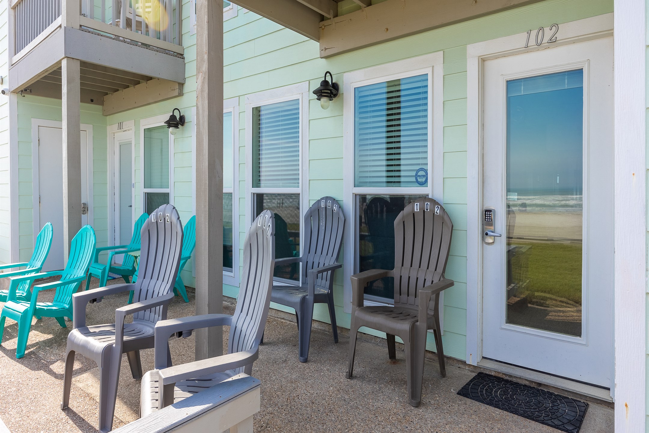 Beachfront entrance to property, #102, coded door lock for added security