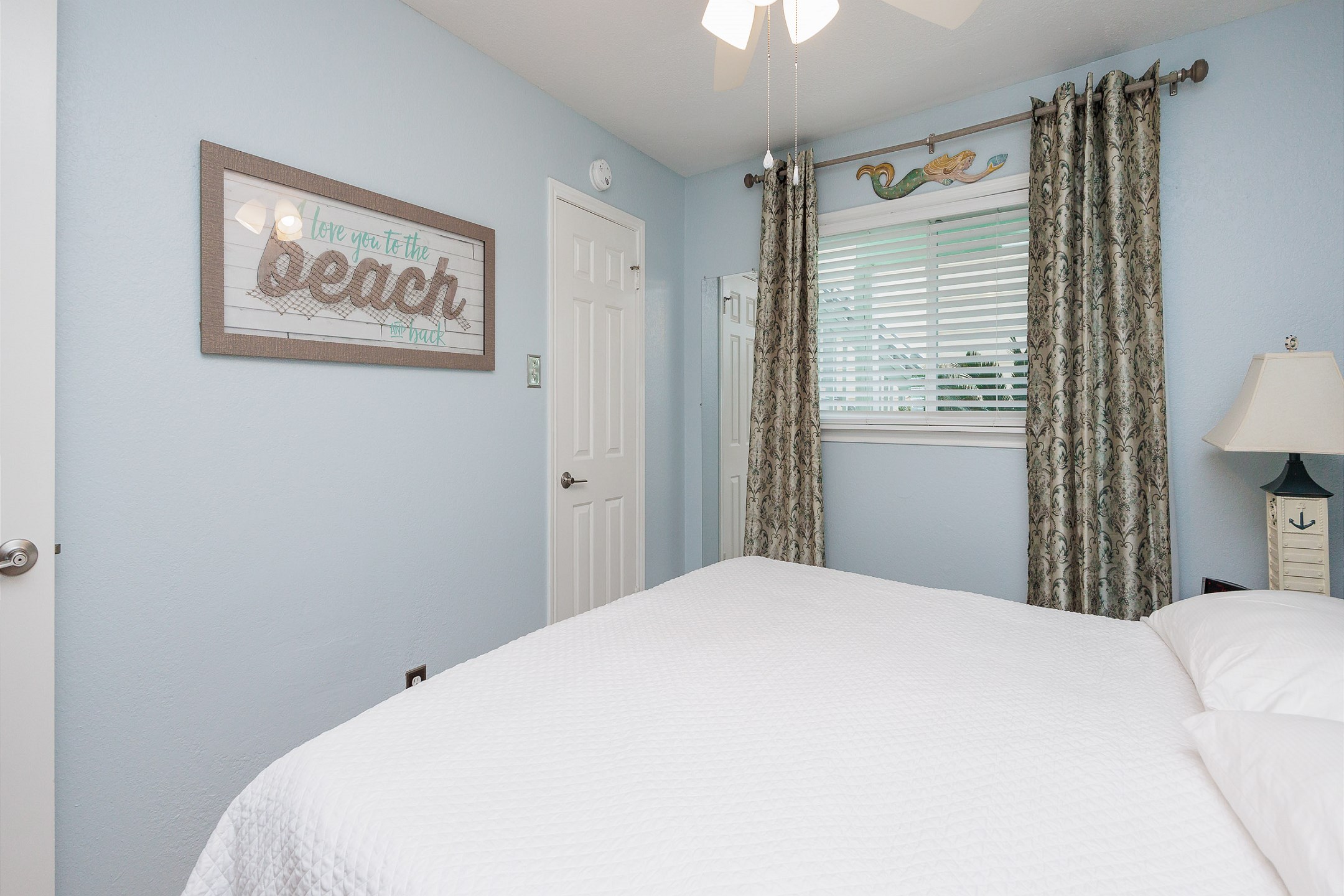 Master bedroom with king size bed and flat screen TV