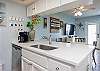 Beautiful kitchen area with new counter tops and 12-cup coffee maker