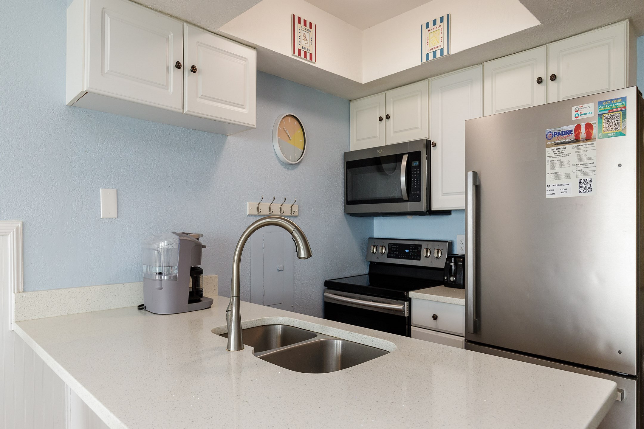 Fully equipped kitchen with stainless steel appliances to cook meals with the family 