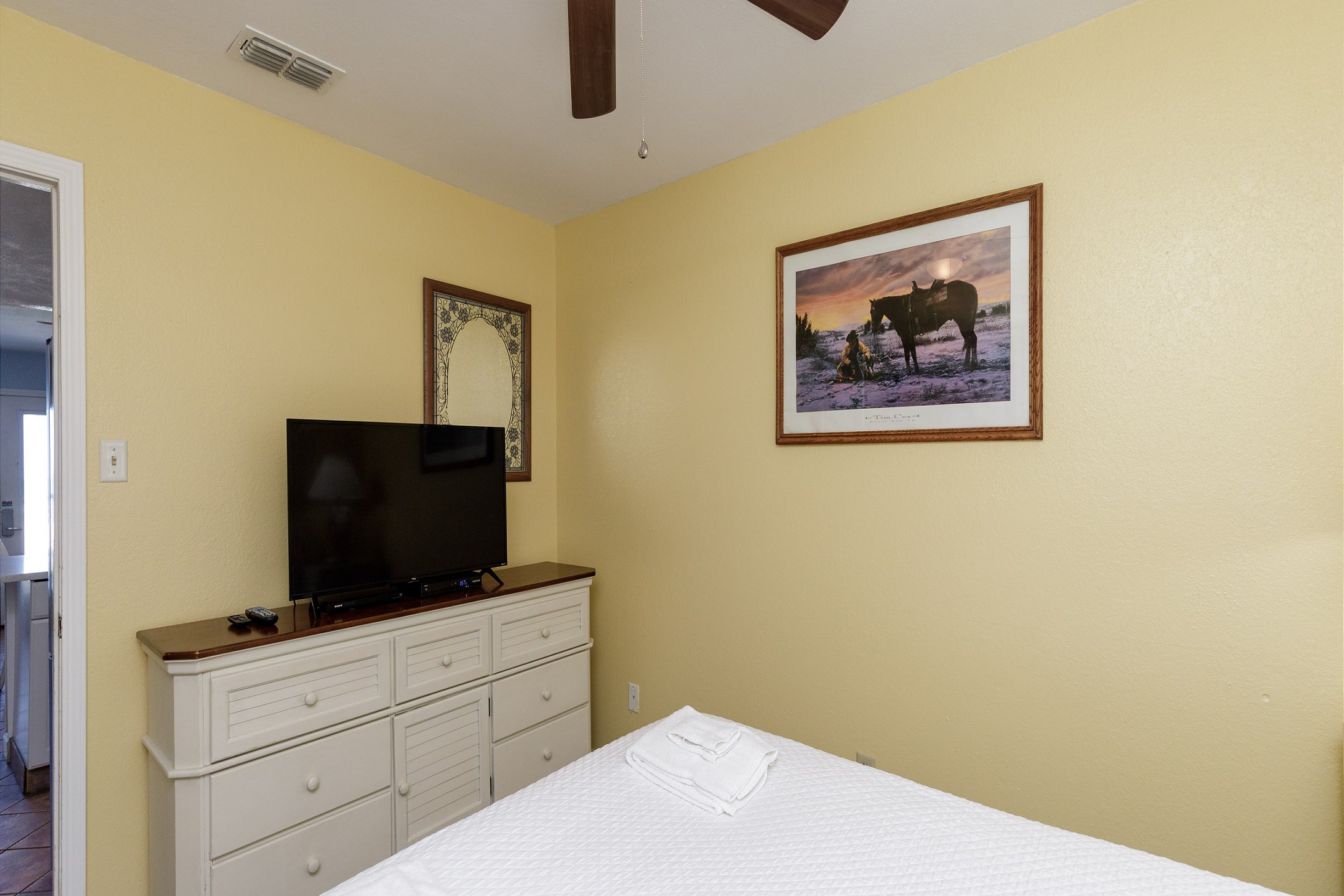 Master bedroom with queen size bed and flat screen TV