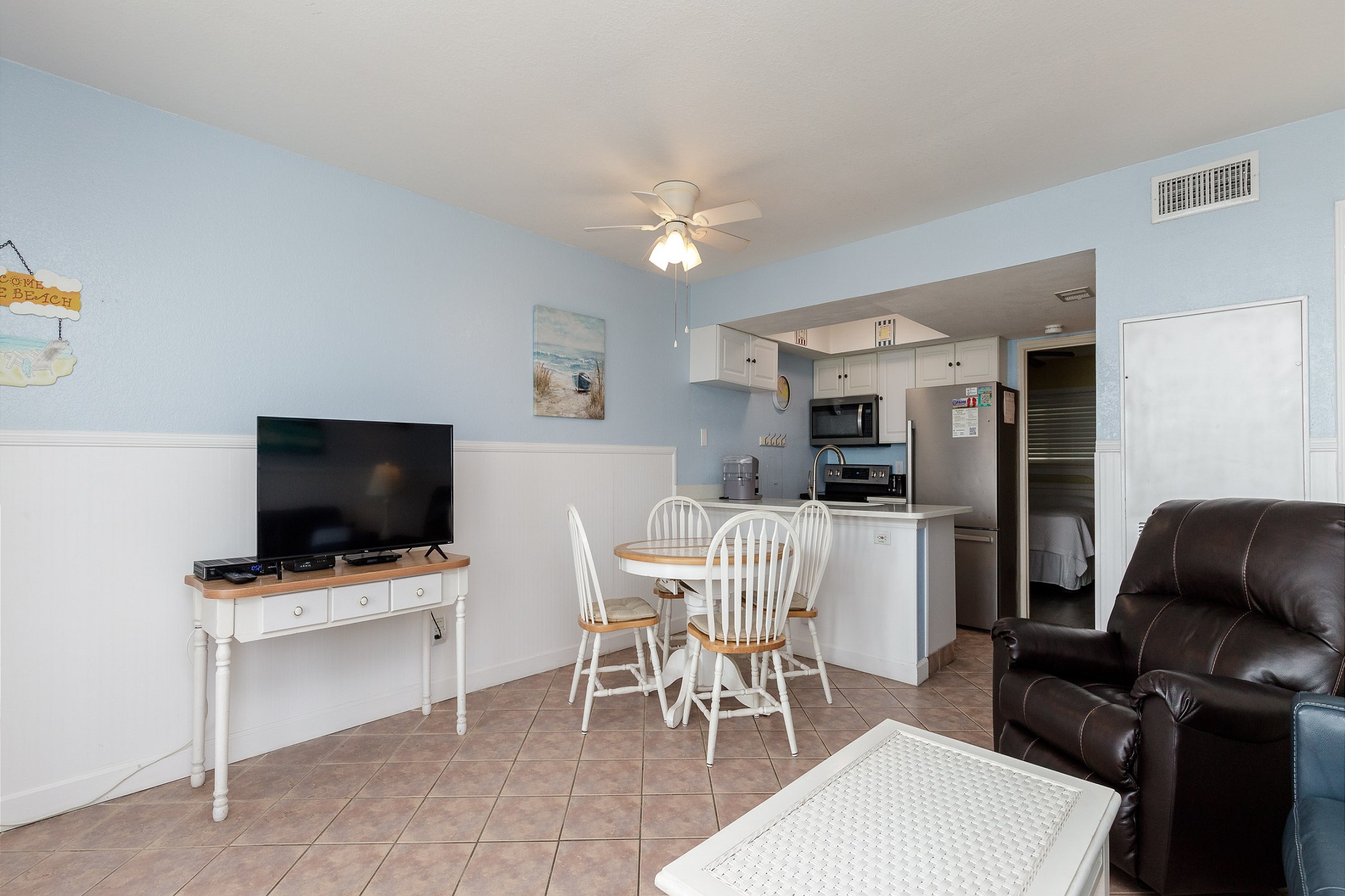 Enjoy the flat screen TV in the living area from any cozy seat