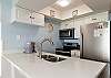 Fully equipped kitchen with stainless steel appliances to cook meals with the family 