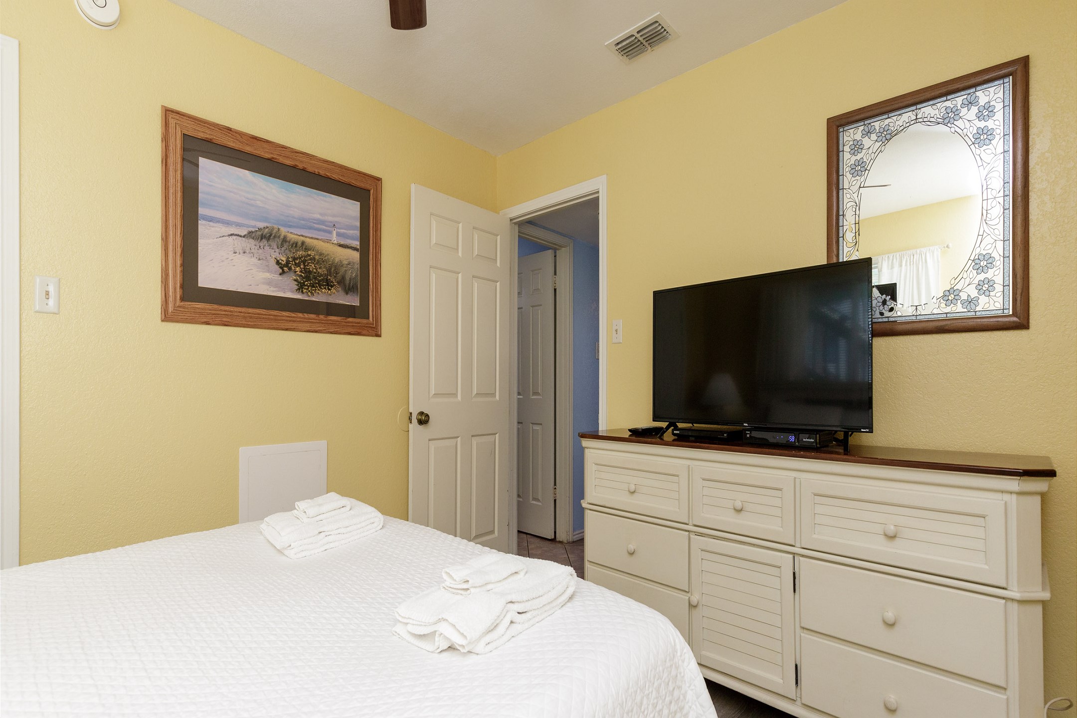 Master bedroom with queen size bed and flat screen TV