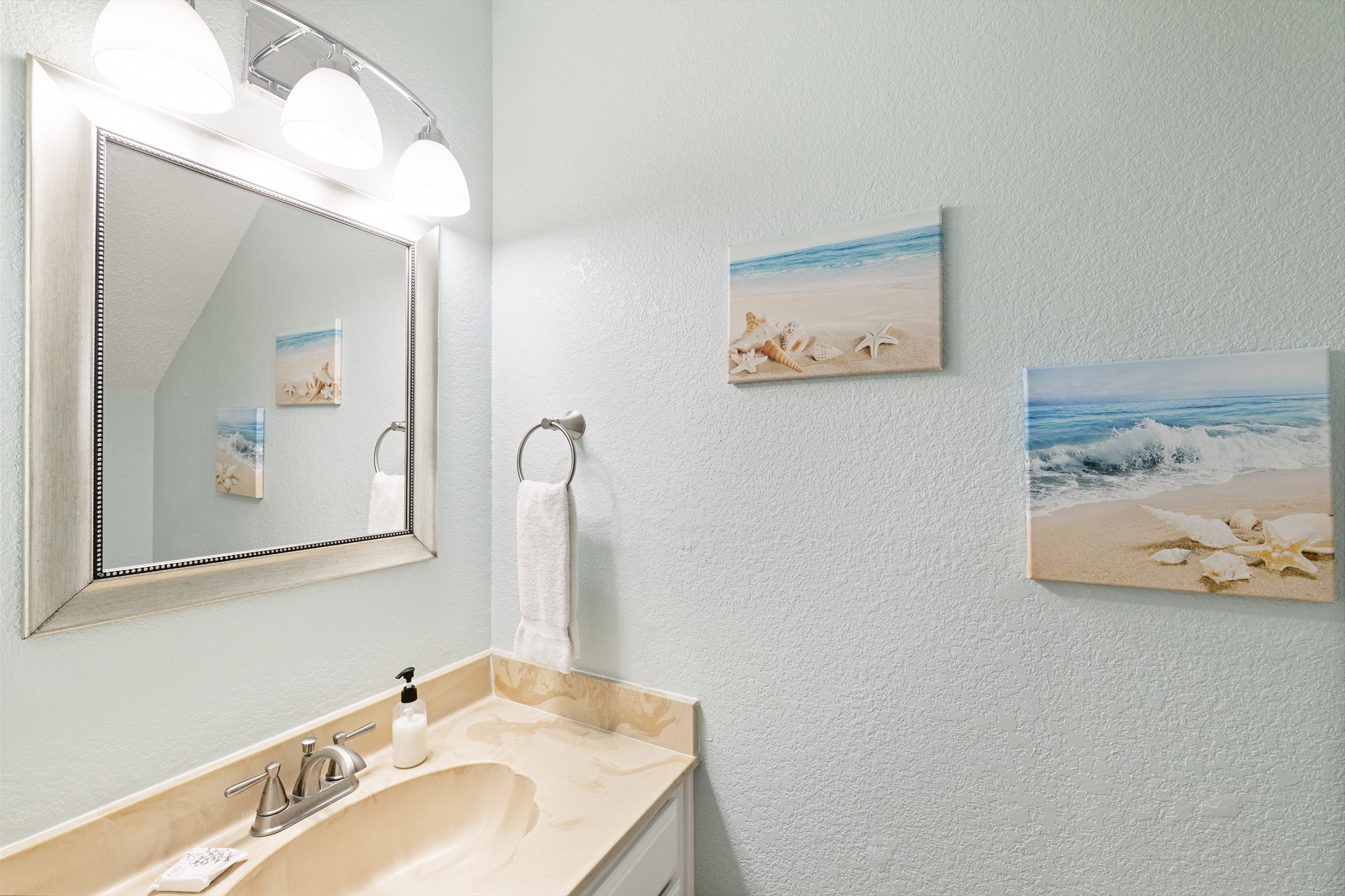 Half bathroom off the living and kitchen space 