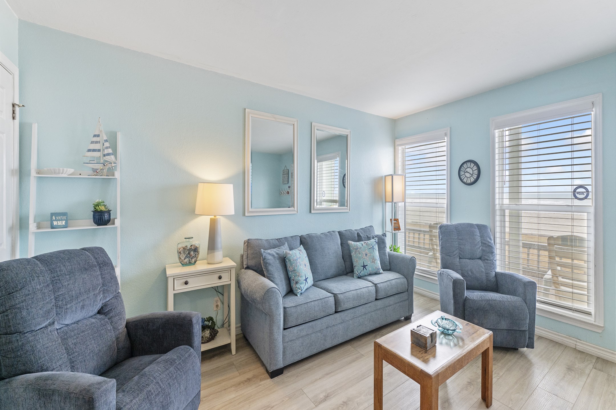 Bright living area with patio leading to the beach