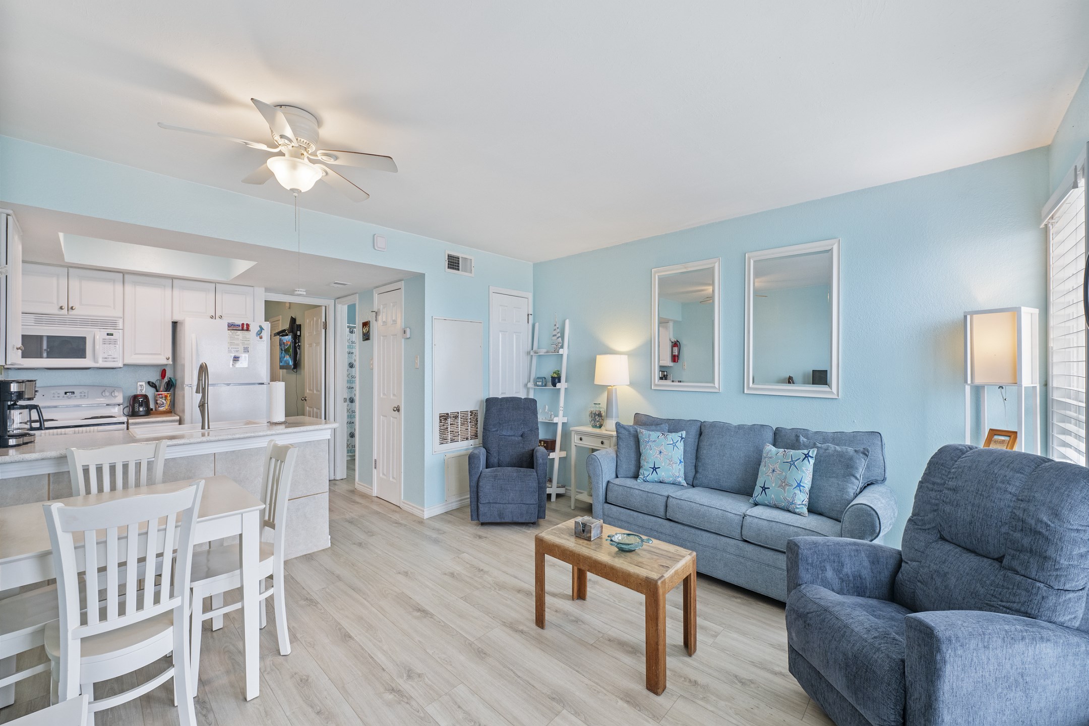 Bright living area with queen size sofa sleeper 