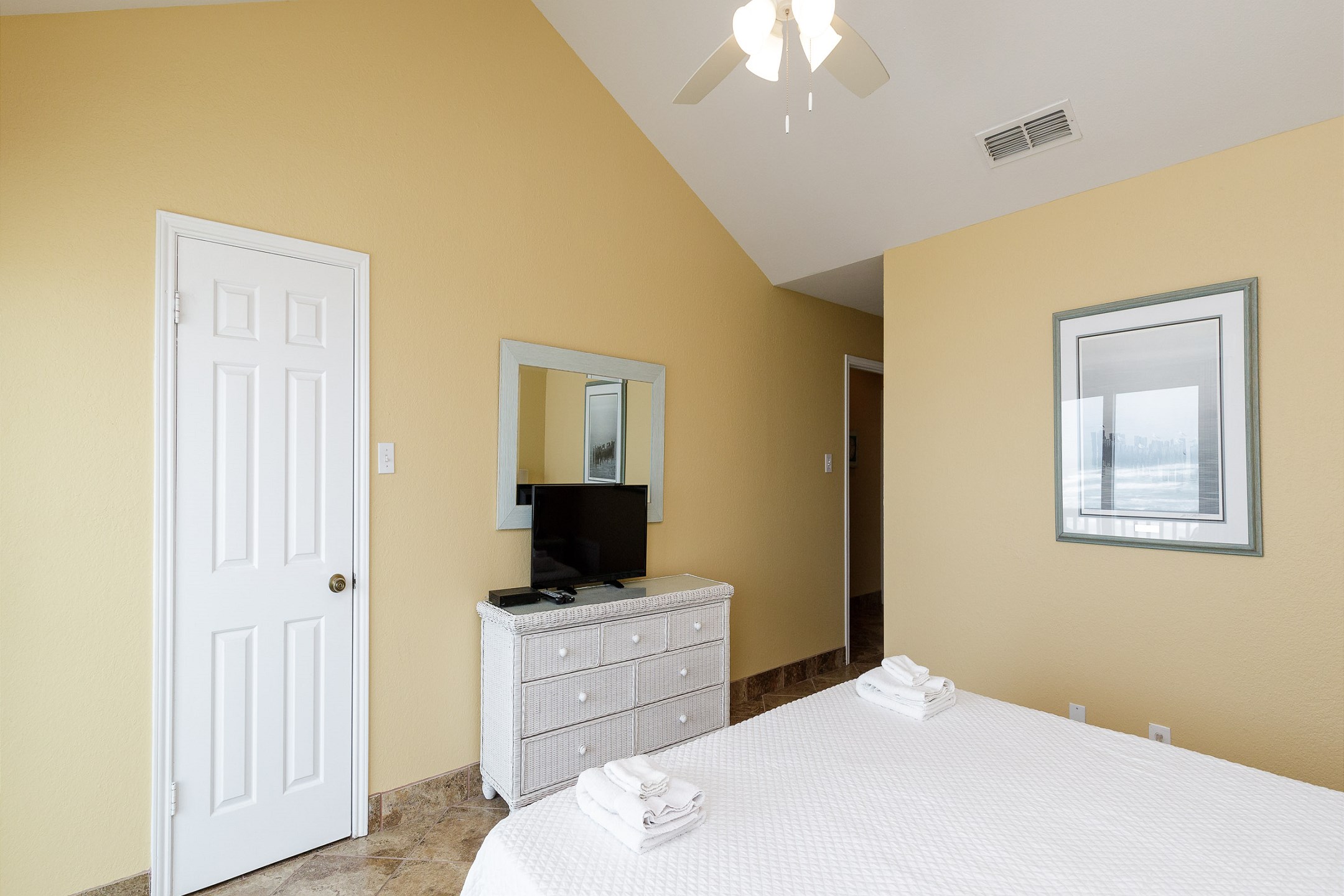 Second bedroom on the second floor with queen size bed, private balcony and flat screen TV
