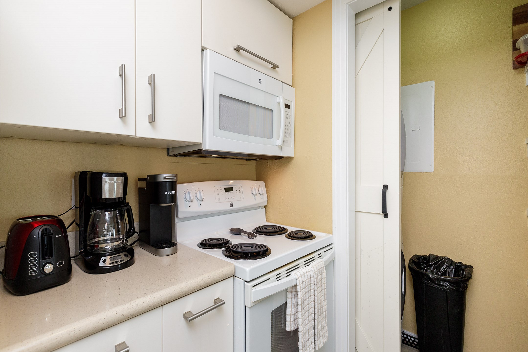 Fully equipped kitchen with coffee maker, toaster, and other essentials provided