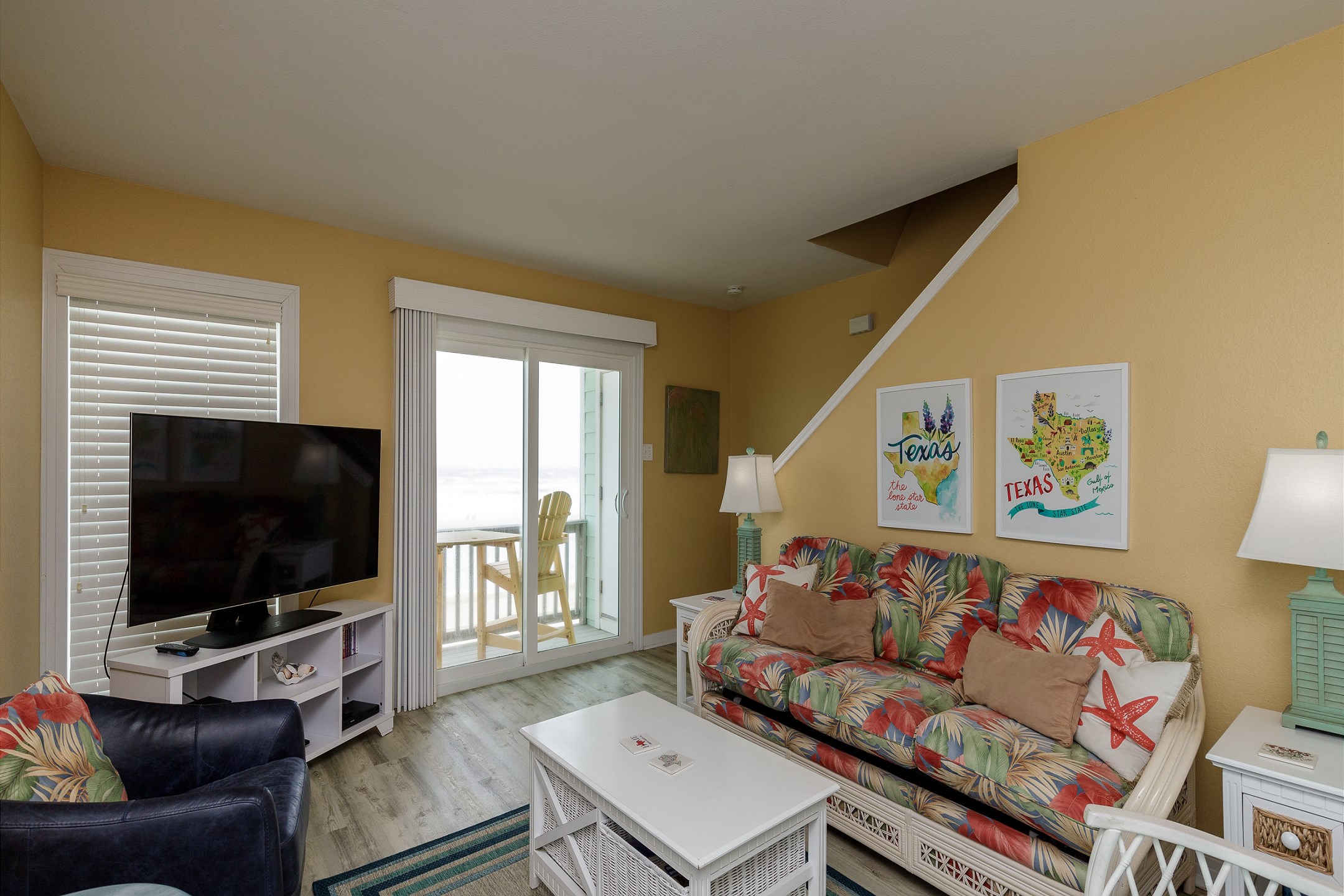 Living area with queen size sleeper sofa and two private balconies
