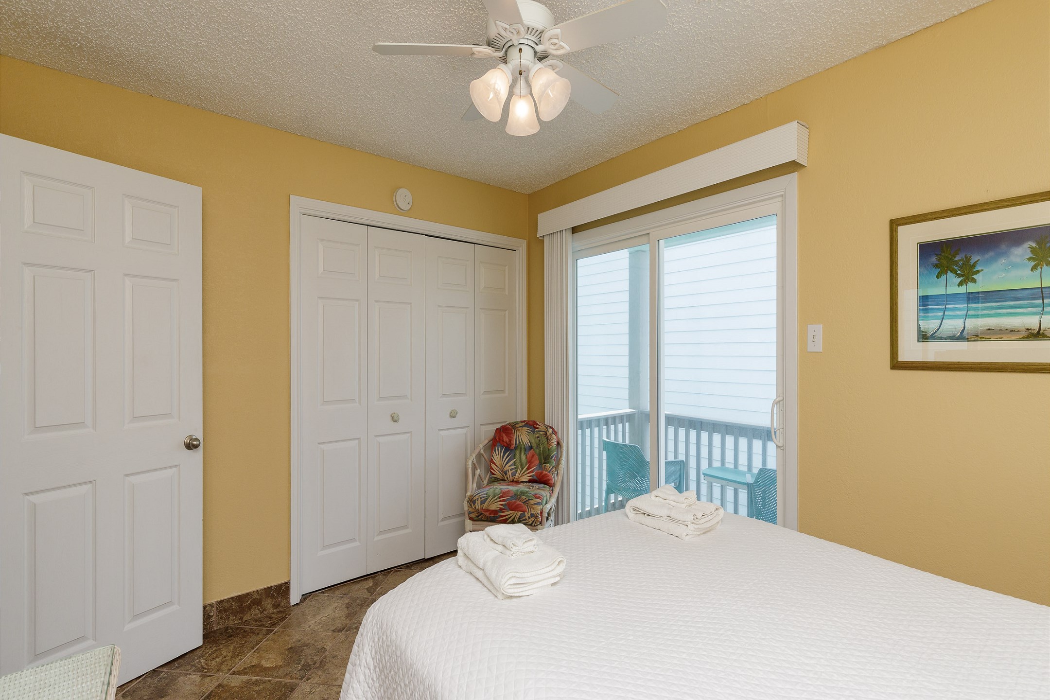 Second bedroom on the second floor with queen size bed, private balcony and flat screen TV
