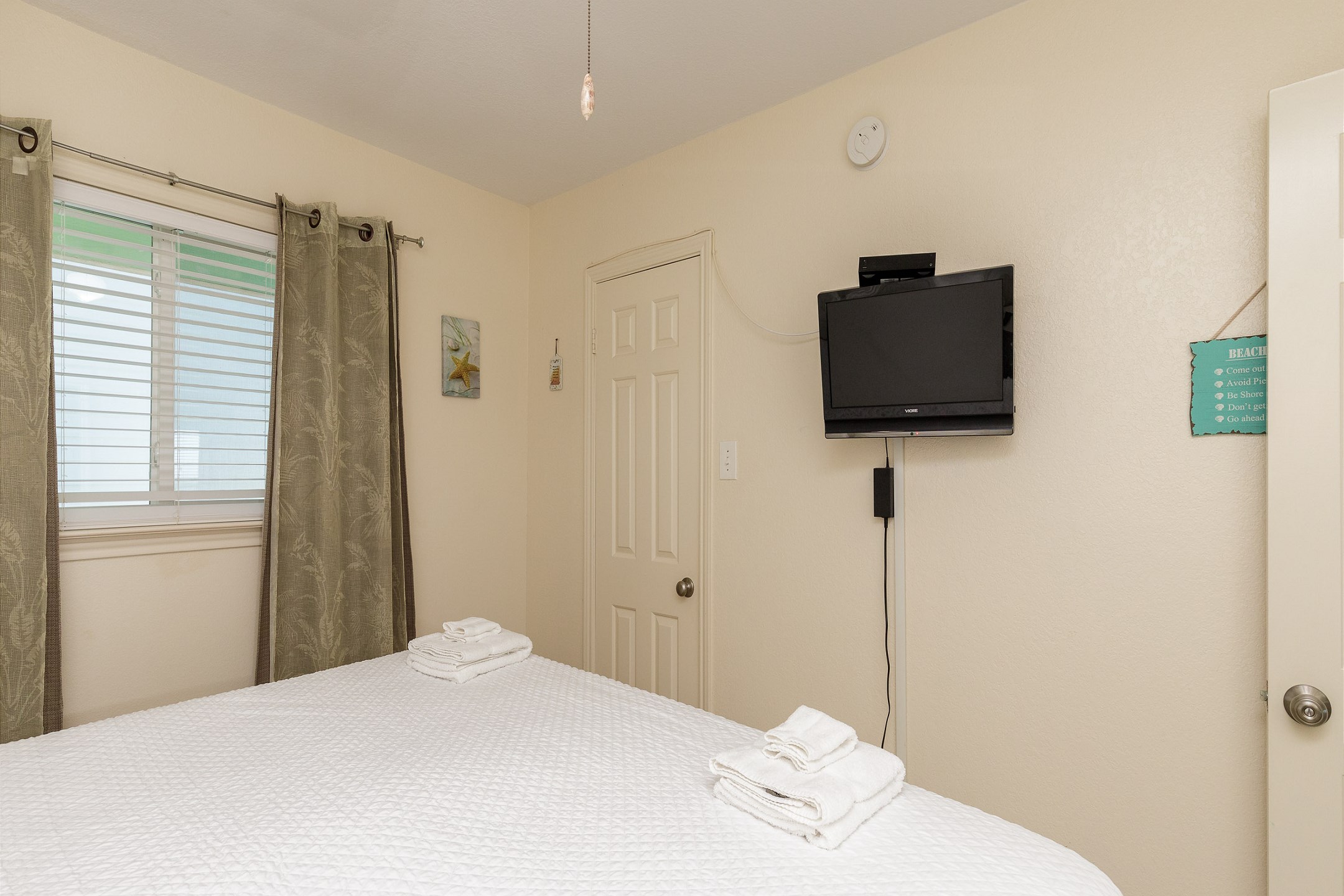 Master bedroom with king size bed and flat screen TV