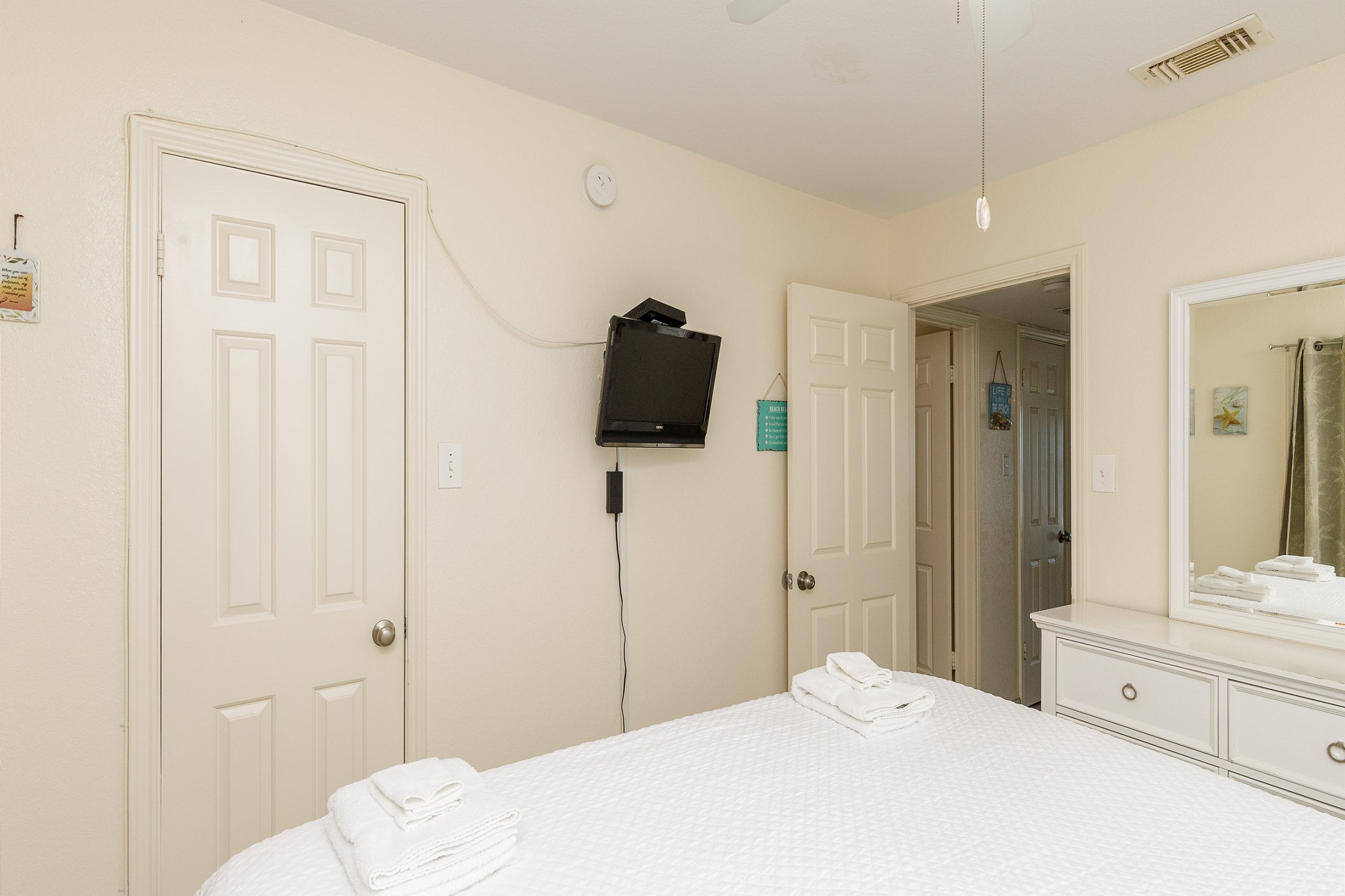 Master bedroom with king size bed and flat screen TV