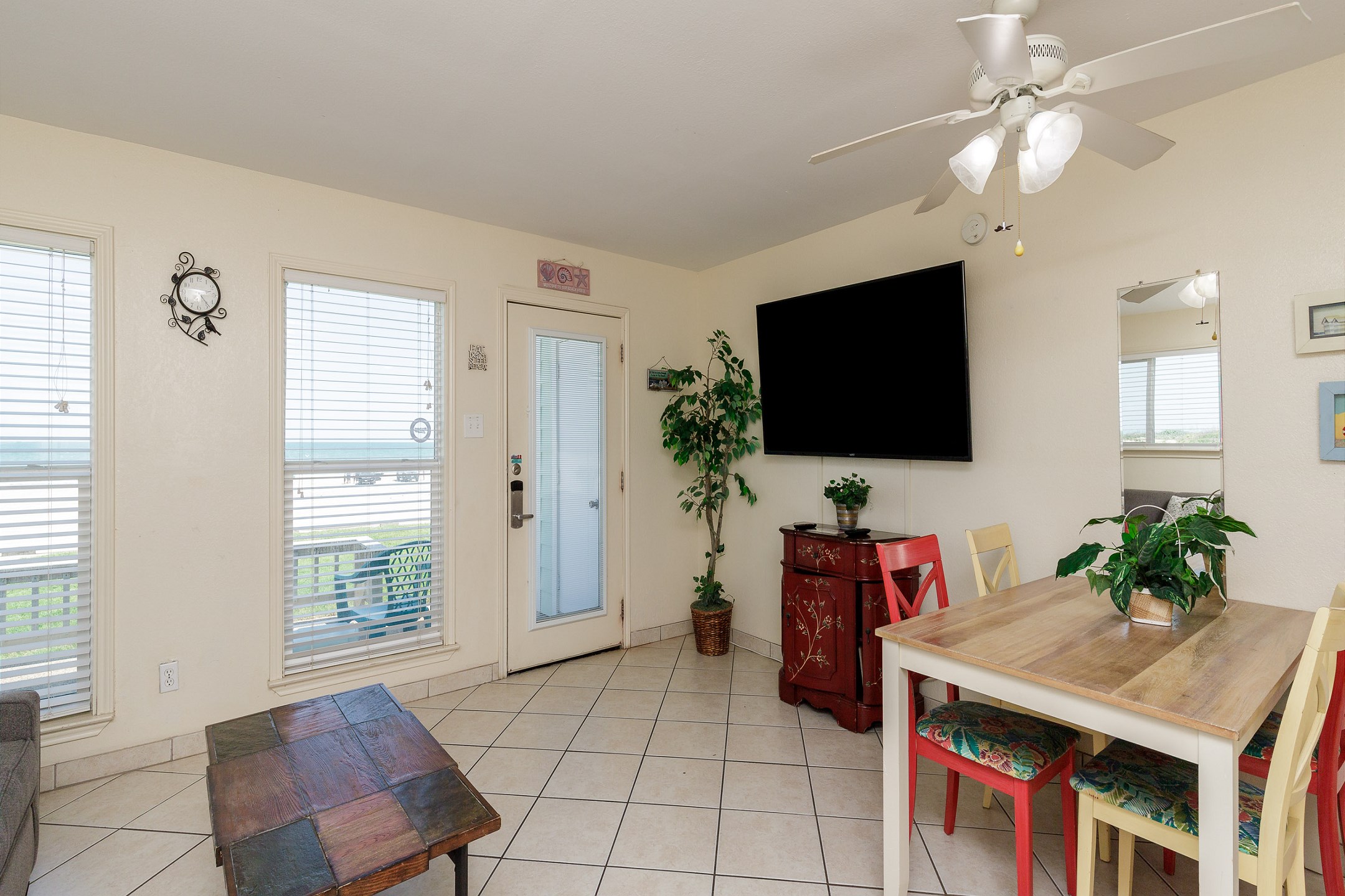 The kitchen, dining, and living areas blend seamlessly for a bright and airy feel