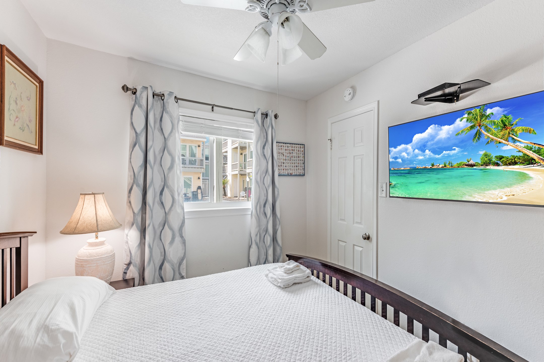 Master bedroom with king size bed and flat screen TV