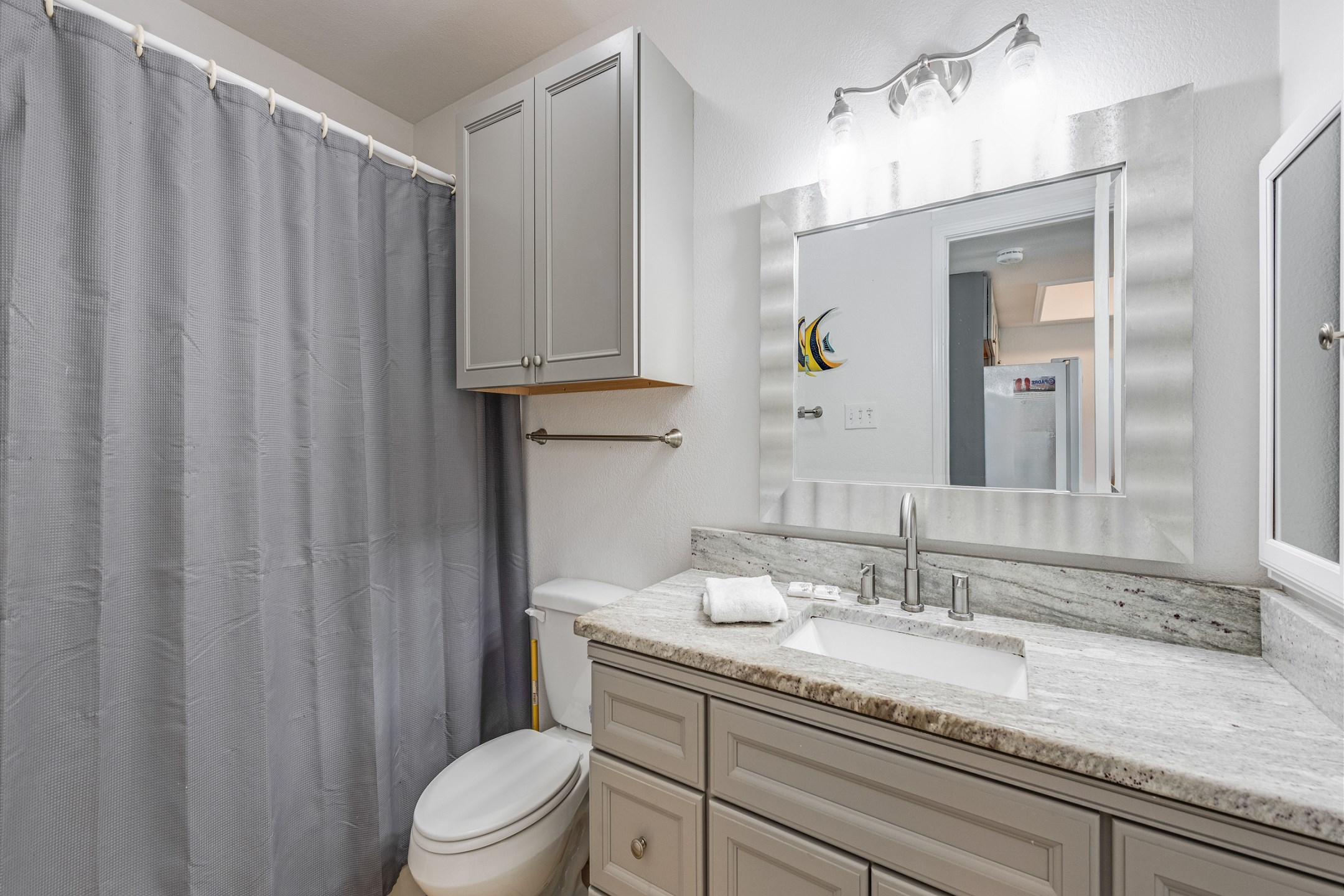 Guest bathroom with tub and shower combo