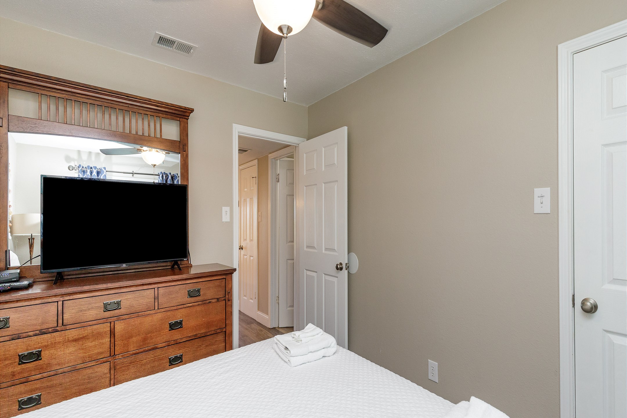 Master bedroom with queen size bed and flat screen TV