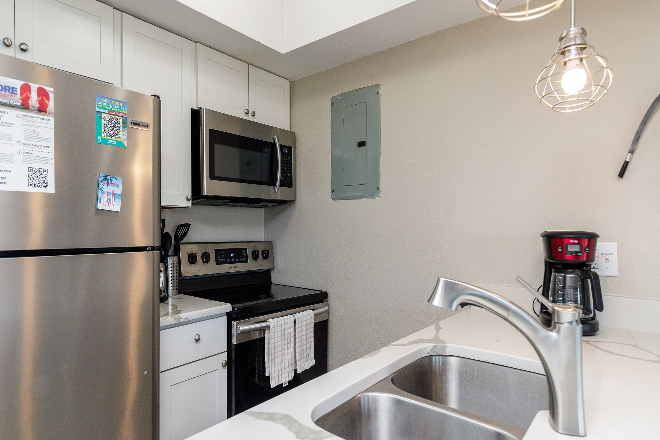 Fully equipped kitchen with stainless steel appliances 