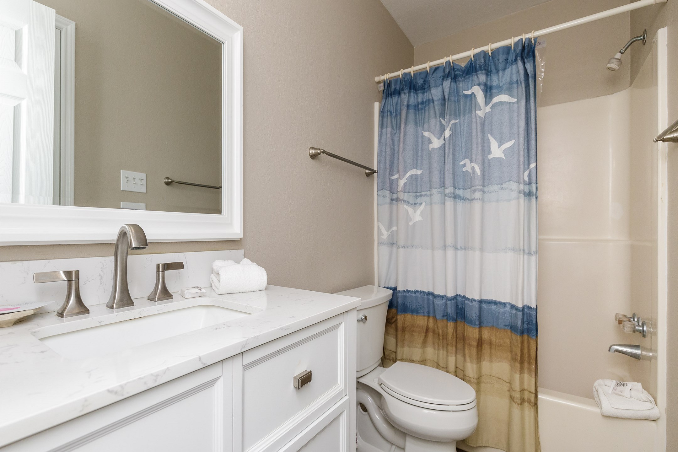 Guest bathroom with tub and shower combo