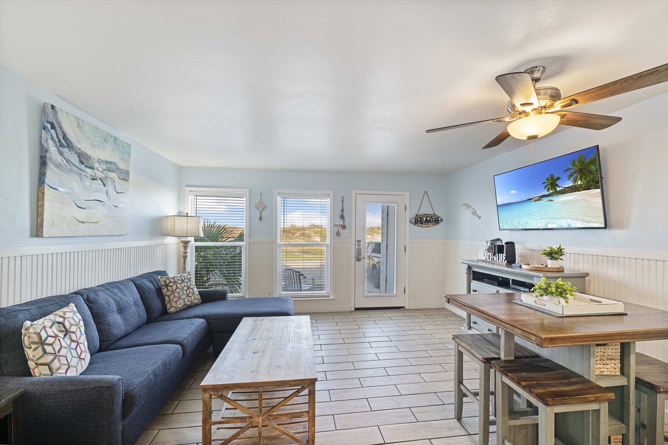 Modern living space with large windows offering great views of the beach