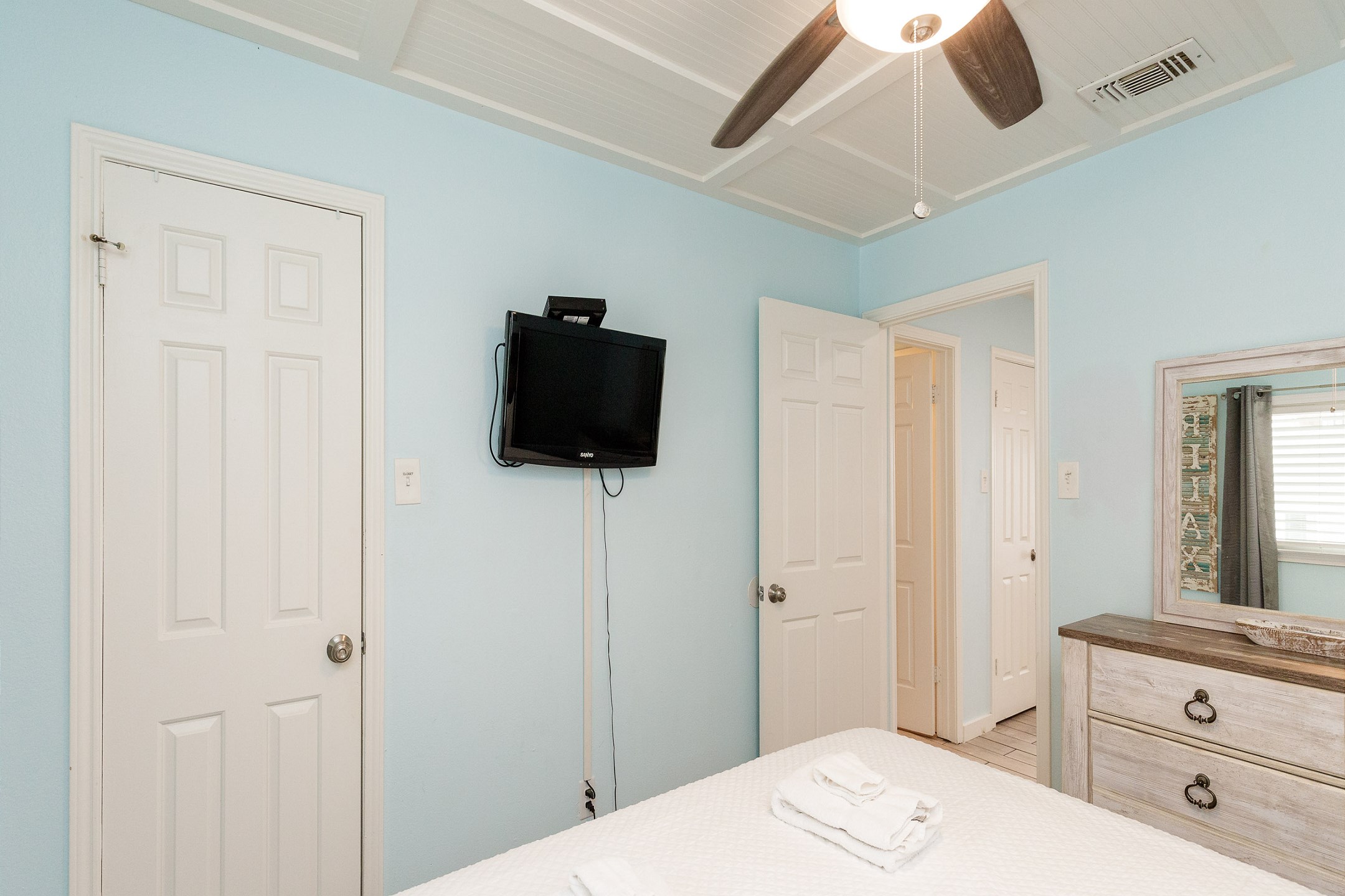 Master bedroom with king size bed and flat screen TV