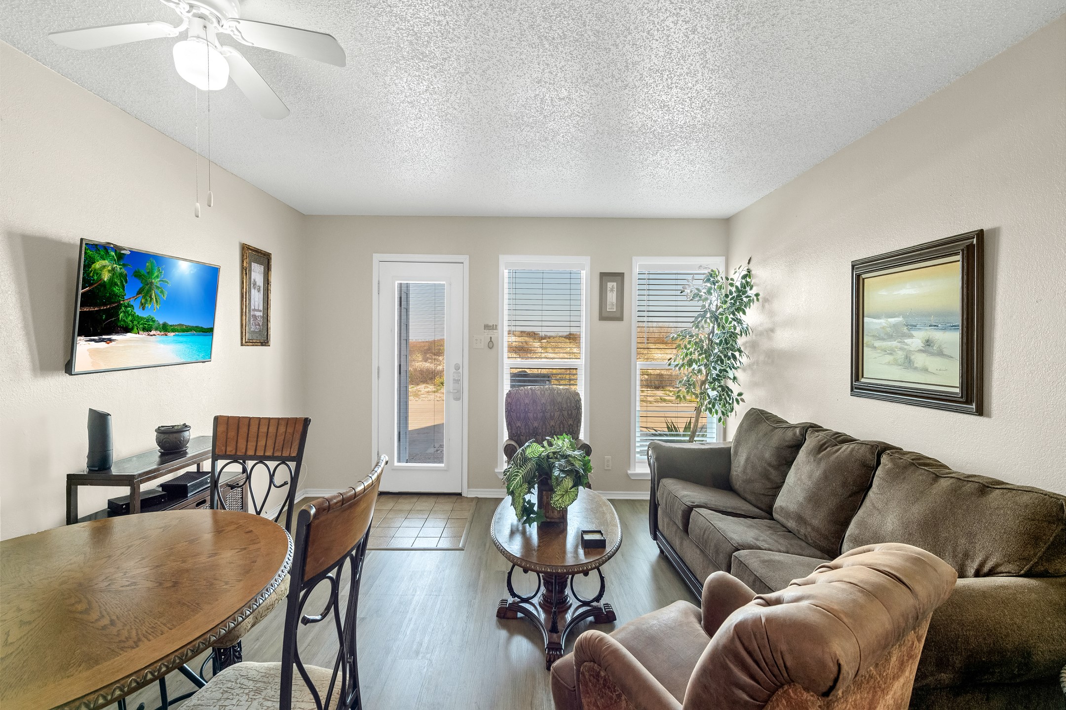 Living area with queen size sleeper sofa and a lovely view of the dunes and partial beach