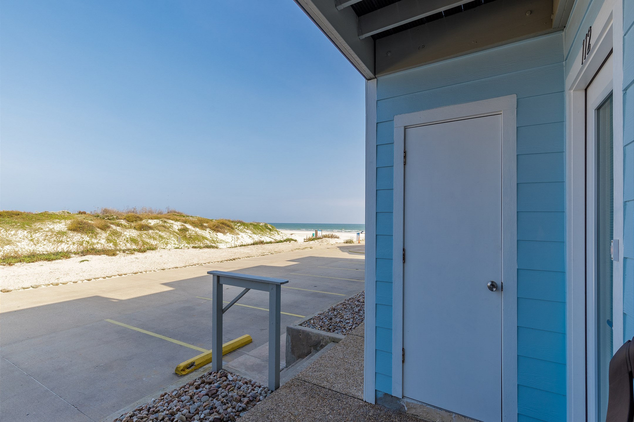 Relax on the patio with a great view and the sound of waves crashing on shore 