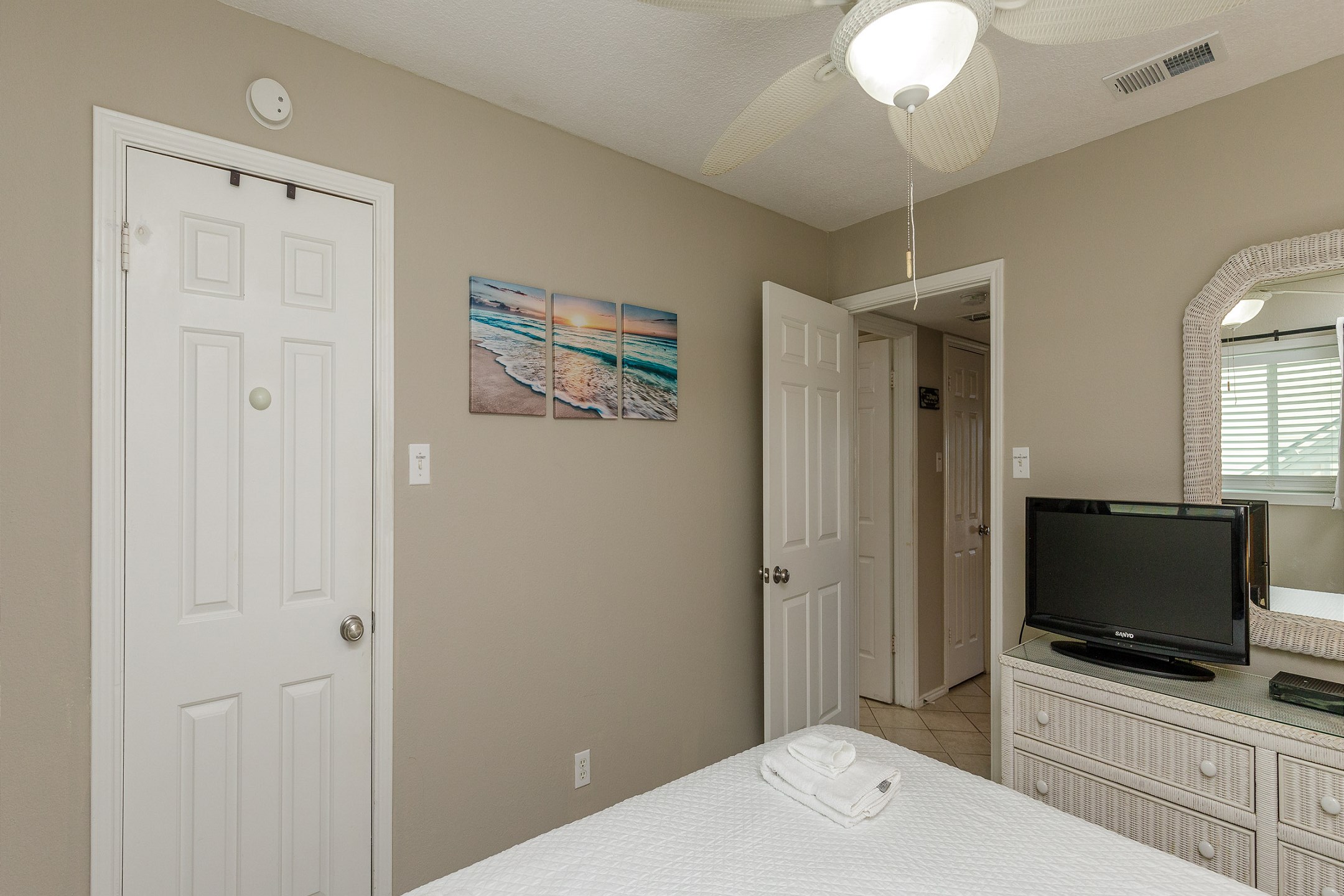 Master bedroom with king size bed and flat screen TV