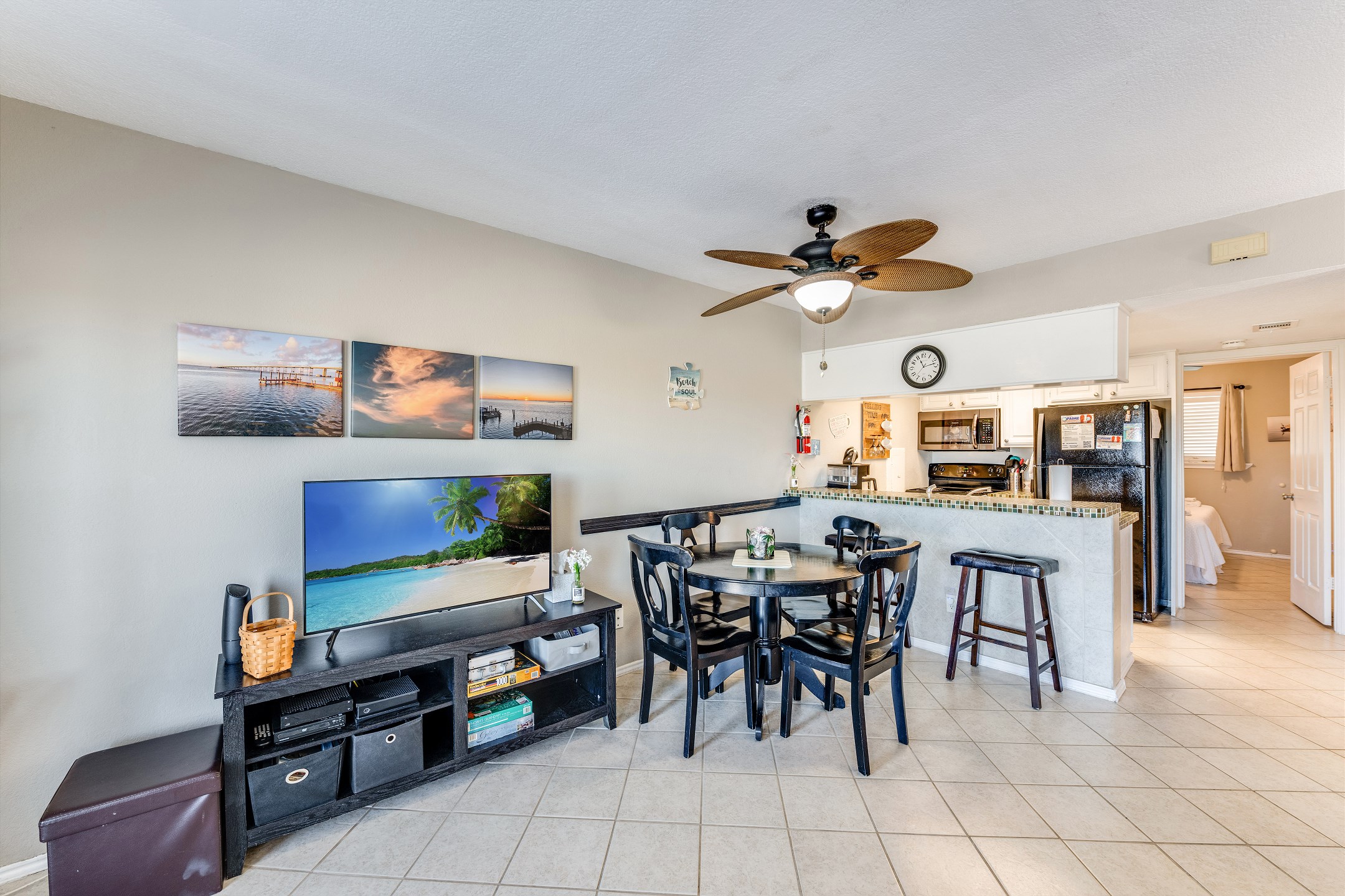 Plenty of seating for everyone at the dining table or breakfast bar while the game or music plays in the background